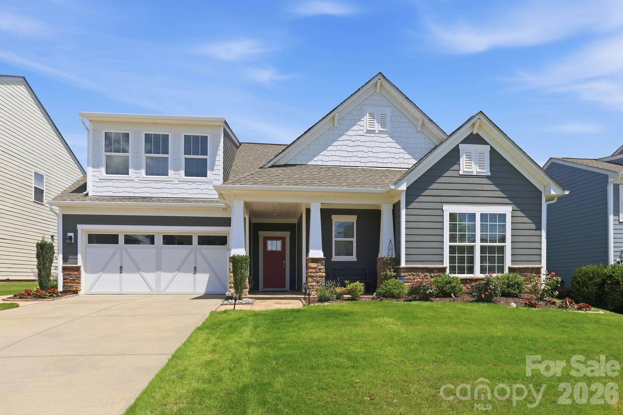 Welcome to Bridgemill, one of the most desirable neighborhoods in Indian Land! This beautifully maintained 1.5-story ranch offers the perfect blend of comfort, functionality, and community. Relax on the charming front porch, then step inside to a wide open floor plan featuring a spacious great room with a cozy corner fireplace, a bright sunroom, and a screened porch with an Easy Breeze window system that lets you enjoy the outdoors almost year-round.

The thoughtfully designed main level includes 3 bedrooms and 2.5 baths, including a spacious primary suite with custom closet. At the heart of the home is a huge open concept kitchen featuring a large granite center island, plentiful cabinetry, and abundant workspace. Upstairs, you’ll find a large 4th bedroom or bonus room with its own half bath—ideal for guests, hobbies, a home office, or media room.

Outside, the fully fenced backyard is exceptionally private and beautifully landscaped, creating a peaceful retreat for entertaining, gardening, or simply unwinding. Additional upgrades include a custom closet in the primary suite and a professionally finished epoxy garage floor.

The location is hard to beat with close proximity to the exciting Ballantyne Bowl, shopping, dining, entertainment, and all the incredible growth happening in Indian Land. This home offers convenience without sacrificing tranquility.

But what truly sets this property apart is the BridgeMill lifestyle. Residents enjoy exceptional resort-style amenities, including two community pools, a large waterslide, splash pad, clubhouse, fitness center, tennis courts, pickleball courts, dog park, playground, picnic areas, game court, recreation fields, scenic pond, and a full calendar of community events. This is a truly social, active neighborhood where there’s always something happening and neighbors quickly become friends.

Meticulously maintained and move-in ready, this home offers the perfect combination of single-level living, flexible space, outstanding amenities, and an unbeatable location in one of Indian Land’s most sought-after communities.