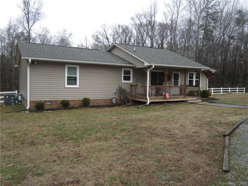 Awesome Family home w over an acre lot w 3 bedrooms & 2 full baths - very well cared for and is close to everything. Fully fenced backyard, circular driveway. Wide open floorplan with lots of natural light and a sunroom. Wonderful eat in kitchen w. tons of space for cooking / entertaining. Great w fireplace has hi volume ceilings and is great for family gatherings. Home is very close to interstates, schools and downtown. Over an acre w woods and tons of privacy for only $169,900. DO NOT WAIT!!