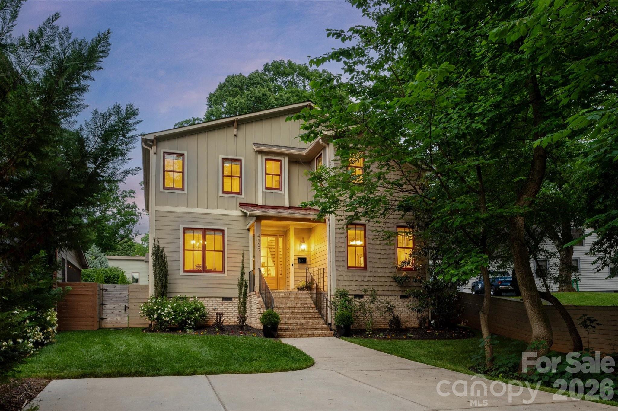 Welcome to one of Oakhurst’s most coveted addresses, perfectly positioned on one of the neighborhood’s best streets. This exceptional home blends timeless design with modern comfort—offering the feel of brand-new construction while delivering the warmth of a thoughtfully curated living space. Built in 2019 and meticulously maintained, this residence lives light, bright, and effortlessly stylish. From the moment you step inside, you’re greeted by elevated ceilings, rich hardwood floors, and an open, airy layout designed for both everyday living and unforgettable entertaining.The front Dining Room sets the tone with designer wallpaper and a chic pass-through connection to the kitchen—equal parts function and flair. The heart of the home unfolds into a stunning Great Room and Kitchen concept, where top-of-the-line appliances, crisp finishes, and a welcoming Breakfast area come together seamlessly. The central fireplace creates a striking focal point, connecting the indoor living space to the screened porch - an inviting retreat that blurs the lines between inside and out. Whether hosting cozy gatherings or enjoying Carolina evenings, this home delivers versatility at every turn. The main-level Primary Suite is a serene escape, featuring a beautifully appointed ensuite Bath with today’s most sought-after clean, modern design finishes. Upstairs, you’ll find four generously sized bedrooms, including one with a private ensuite, ideal for guests. Plus an additional hall Bath. The flexible loft space offers endless possibilities: media space, play area, home office, or study zone. Step outside to a ideal, flat backyard, designed for both relaxation and play. Enjoy evenings around the built-in firepit, entertain on the paver patio, tend to garden beds, or simply enjoy the open green space. An exterior storage shed keeps everything organized and accessible. All of this in the heart of Oakhurst - one of Charlotte’s fastest-growing and most walkable neighborhoods - just minutes to Uptown, dining, retail, and everything the city has to offer. This is more than a home—it’s a lifestyle upgrade in one of Charlotte’s most exciting communities.