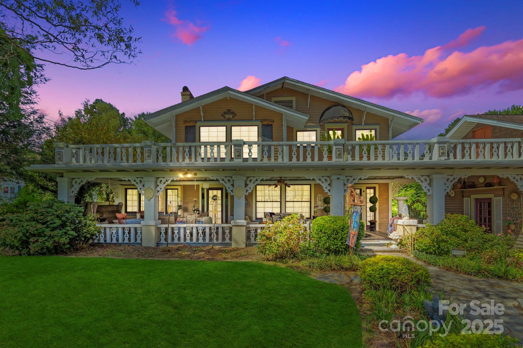 MOTIVATED SELLERS! This stunning home built in 1915 is a marvelous piece of Hendersonville architecture. With the original wooden floors one can appreciate true craftsmanship. The home was purchased by a family in 1984 and lovingly restored the kitchen throughout the years along with other updates such as the stained glass window that brings in the morning light through the staircase. The bedrooms overlook the balcony and the primary bedroom has access to the balcony that looks over the beautiful yard and gardens. Home has three spacious bedrooms, an additional office space, reading nook off the garden area in the back, artist nook above the garage and many more features that make this home special.  The location is simply unmatched being so close to Hendersonville's downtown!  This home offers endless opportunities with its space. This would make a great investment opportunity for someone as well.