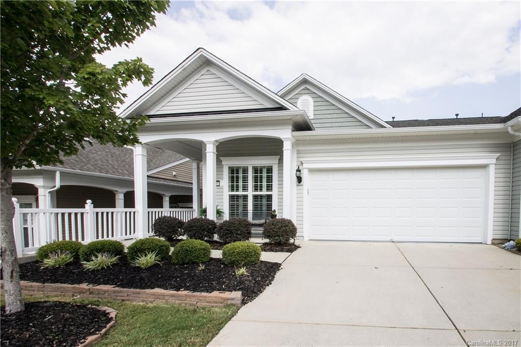 Popular Muirfield Villa w/ screened porch & private yard. Foyer w/ wainscotting leads to great room w/ceiling fan. Rear kitchen w/ granite counters, UCL, cabinet roll-outs, backsplash, island & dining nook w/ great natural light. Lovely Mahogany hardwoods, plantation shutters, crown molding & large baseboards throughout. Plus fine details such as:extra kitchen cabinetry, granite in the master bath, garage w/ cabinetry & sink & paver patio. Don't miss this Muirfield-it won't last long! 55+ Comm.