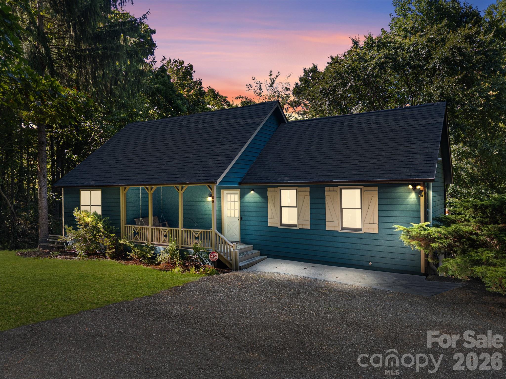 Private mountain charm meets modern comfort in this beautifully updated 2BR/1.5BA cottage, perfectly situated on a serene, private setting just minutes from Asheville Regional Airport, AdventHealth, downtown Hendersonville, and vibrant downtown Asheville. The freshly painted interior enhances the warm and inviting great room, featuring cathedral ceilings, a cozy wood-burning stove, and rich hickory floors flowing throughout the open floor plan. The spacious kitchen and dining area make entertaining easy, while the main-level primary suite offers comfort with its own ensuite bath, plus a flexible office/bonus room and convenient main-level laundry. Upstairs, you'll find a large second bedroom, a charming reading nook, new luxury vinyl plank flooring, and a recently installed mini-split system for year-round comfort. Outside, relax on the covered front porch with swing, unwind in the screened porch, or entertain on the expansive deck overlooking the peaceful surroundings. The standing-height crawl space provides exceptional storage for lawn equipment, bicycles, kayaks, and more. Offering exceptional privacy, character, and convenience, this inviting cottage is ideal as a full-time residence, mountain getaway, or investment opportunity in the heart of Western North Carolina.