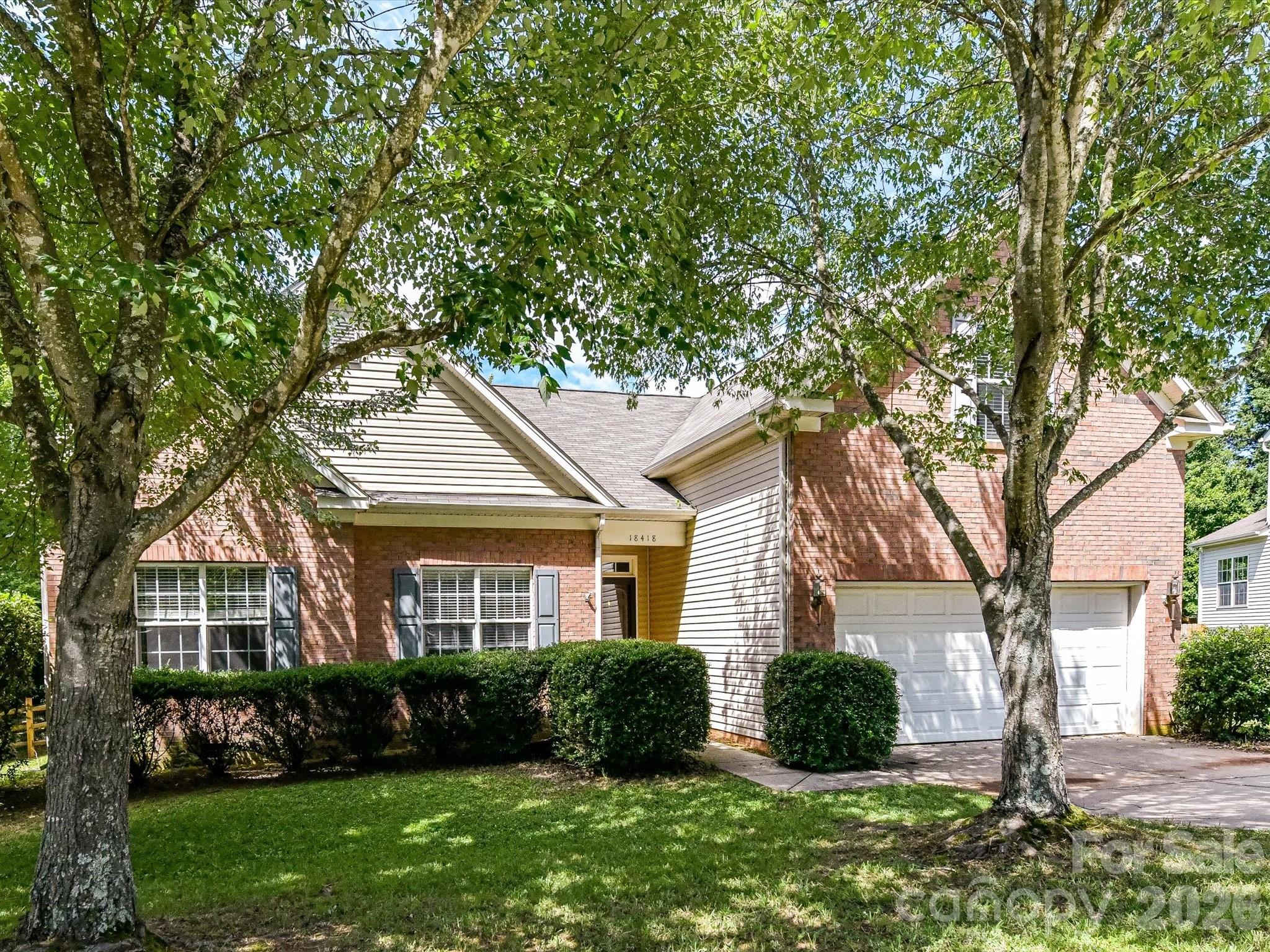 Welcome to this beautifully maintained home nestled on a spacious, tree-lined lot just minutes from Lake Norman and the heart of Davidson. Offering a functional layout and versatile living spaces, this home combines comfort, convenience, and an unbeatable location.  The main level features an open-concept living area with abundant natural light, durable flooring, and seamless flow into the kitchen with Granite counters, Stainless Steel appliances, abundant cabinetry for storage and tile backsplash and dining spaces, creating an ideal setting for everyday living and entertaining. Office/Sunroom/Flex Room offers plenty of natural light. The primary suite offers a private retreat complete with a generously sized walk-in closet featuring custom built-in shelving and organization systems plus an ensuite with garden tub/shower combo.  Additional bedrooms provide flexibility for family, guests, or a home office, while a full secondary bath serves the upper level. A spacious bonus room/bedroom with vaulted ceilings offers endless possibilities as a media room, playroom, fitness area, or additional living space.  Step outside to enjoy the elevated back deck overlooking a large, private backyard shaded by mature trees. The expansive yard provides plenty of room for outdoor recreation, gardening, pets, and entertaining, while the detached storage shed offers convenient space for tools, equipment, and seasonal items. Located near Lake Norman, residents can enjoy easy access to boating, fishing, waterfront dining, and year-round recreation.  It is a true MUST SEE!