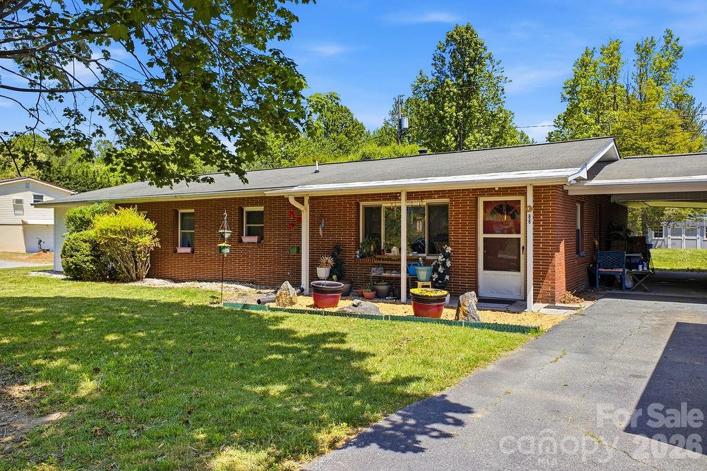 Welcome to this 3 bedroom, 2 bathroom single story home in beautiful Flat Rock, North Carolina. This unrestricted property offers flexibility for homeowners, investors, or buyers looking for a project they can make their own. Conveniently located just minutes from I-26, with easy access to Hendersonville, Asheville, and Greenville. The home sits in a practical location while still offering a more private, tucked-away feel. Spacious and level backyard is complete with a large storage building which provides additional storage. Bring your ideas and take advantage of the opportunity to update, improve, or use the property to fit your needs.