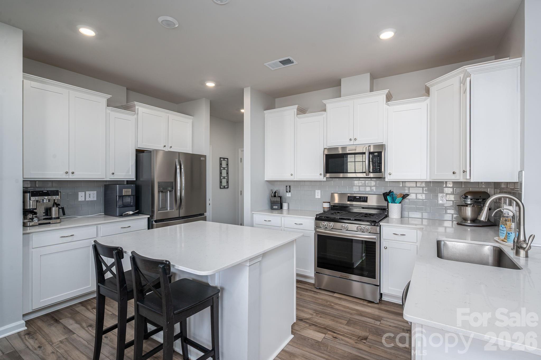 ASSUMABLE VA LOAN WITH 5.875% INTEREST RATE! SELLERS ARE VERY MOTIVATED! Welcome home to this nearly new 2024 Durham floorplan in the desirable Shannon Woods subdivision. Offering 2,818 square feet, this spacious 4-bedroom, 2.5-bath home blends modern design with everyday comfort.

The open-concept main level features a gas fireplace perfect for cozy evenings, a gas range, stainless steel appliances, quartz countertops, and a generous walk-in pantry—ideal for entertaining and daily living. The kitchen flows seamlessly into the living and dining areas, creating a bright and inviting space.

Upstairs, you’ll find well-sized bedrooms complete with ceiling fans for added comfort, along with ample storage throughout. The primary suite offers a relaxing retreat with a spacious layout and private bath.

Enjoy outdoor living in the fenced-in backyard, perfect for pets, play, or gatherings. Additional highlights include a 2-car garage and modern finishes throughout.

Shannon Woods offers fantastic community amenities, including a swimming pool, clubhouse with gym, and playground—all just steps from home. Move-in ready and thoughtfully designed, this home checks every box for style, space, and convenience.