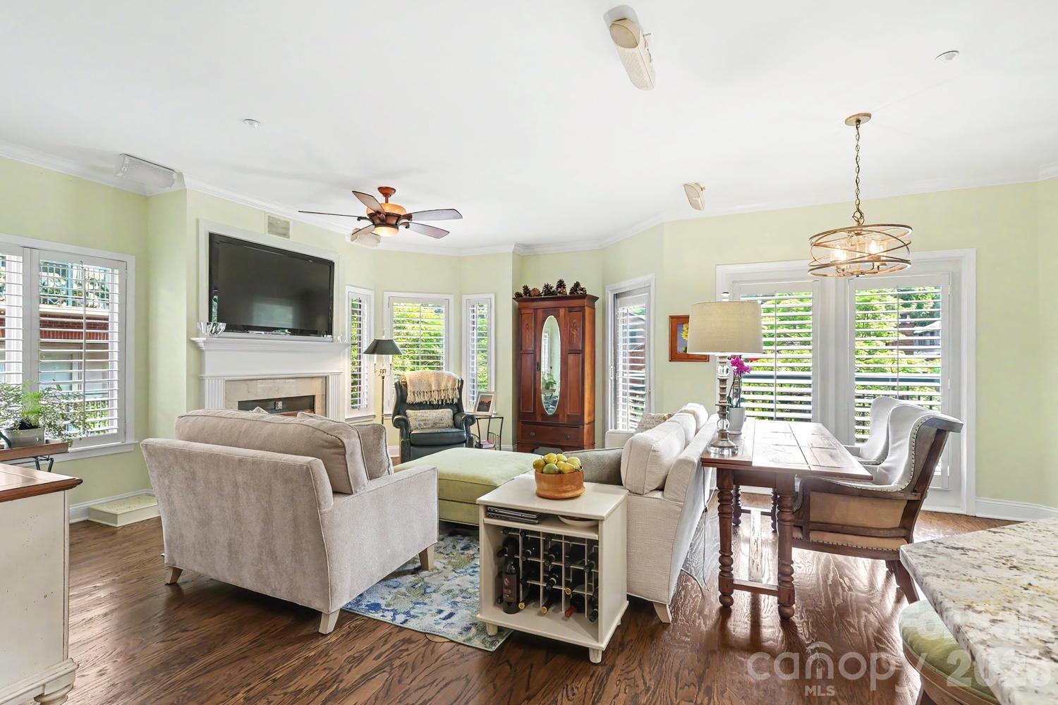 Welcome to Jefferson Square in the heart of quaint, historic Fourth Ward. This unit has been so meticulously maintained that you'll think it's brand new! Truly turn-key, just move in and instantly enjoy Uptown living. Abundant natural light floods this quiet end-unit, with many upgrades.  The gourmet kitchen has been dramatically transformed with KraftMaid soft-close cabinets, a corner lazy Susan for added storage, expanded counter space, and all SS appliances. You'll feel like a professional chef cooking on your 5-burner gas range (new in 2024) while your guests sit at the one-level granite countertop and watch you perform.  This kitchen now opens seamlessly into the living room and dining area, ideal for entertaining.  
The serene Primary Suite includes a large bedroom with tray ceiling, walk-in closet, and roomy bath. The frameless glass shower has been enlarged, the floors tiled with large porcelain tiles, and countertop replaced with quartz. The second bedroom overlooks the courtyard and has private access to the 2nd full bath. The third bedroom serves as an office, artist studio, or den/media room. Traditional moldings and plantation shutters throughout, richly refinished hardwood floors, and carpeted bedrooms. The surprisingly large laundry room accommodates the side-by-side W/D that convey.
Enjoy your morning coffee or an end-of-day glass of wine on your private balcony or head down to the peaceful courtyard between the two buildings. The unit comes with two deeded parking spaces and a dedicated storage closet on the security-gated underground garage. 
Living here, you'll enjoy convenient proximity to all that this city offers--many restaurants, Romare Bearden and Fourth Ward parks, Blumenthal PAC, Mint Museum, jazz clubs, Spectrum Center, Truist Field, BOA Stadium, and more. 
What had begun as a two-year experiment in urban living for the owners turned into a wonderful eight-year stay. Might this be the place for your next adventure?