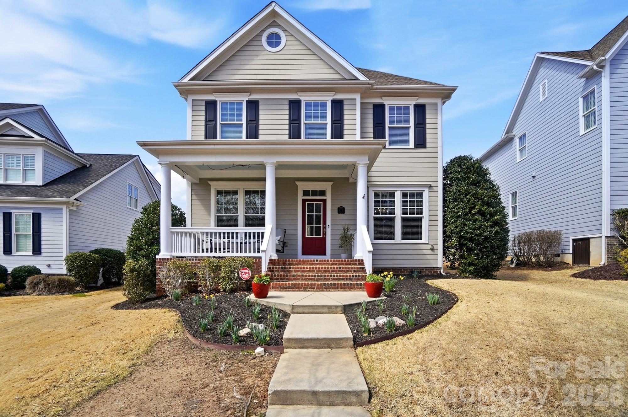 Located in the highly sought-after Baxter Village community, this beautifully updated David Weekley-built home offers timeless charm and thoughtful upgrades. Featuring 2,502 square feet, this two-story home includes a welcoming covered front porch, open floorplan, fenced backyard, and detached rear-load two-car garage. The beautifully updated kitchen is the heart of the home with a custom-built island with added storage, new cabinet doors, new countertops, new upper cabinetry, under-cabinet lighting, and a custom hood vent. The main level also features a spacious great room with fireplace, dining room with custom board and batten millwork, dedicated office with built-in desk and cabinetry, and a bright sunroom. Upstairs, the primary suite offers an updated bath and California Closet system, with additional custom closet storage in a secondary bedroom. Additional improvements include hardwood stair treads with iron balusters, enclosed loft space, updated fireplace surround and mantle, and newly tiled laundry room. Major updates include a tankless water heater (2024), sealed crawl space, and a full in-ground irrigation system with drip lines servicing flower beds and porch planters. Enjoy all that Baxter Village offers, including walking trails, clubhouse, pools, tennis courts, playgrounds, and convenient access to shops and restaurants, plus top-rated Fort Mill School District schools. Fantastic location just minutes to I-77, downtown Fort Mill and all that uptown Charlotte has to offer. Welcome home!