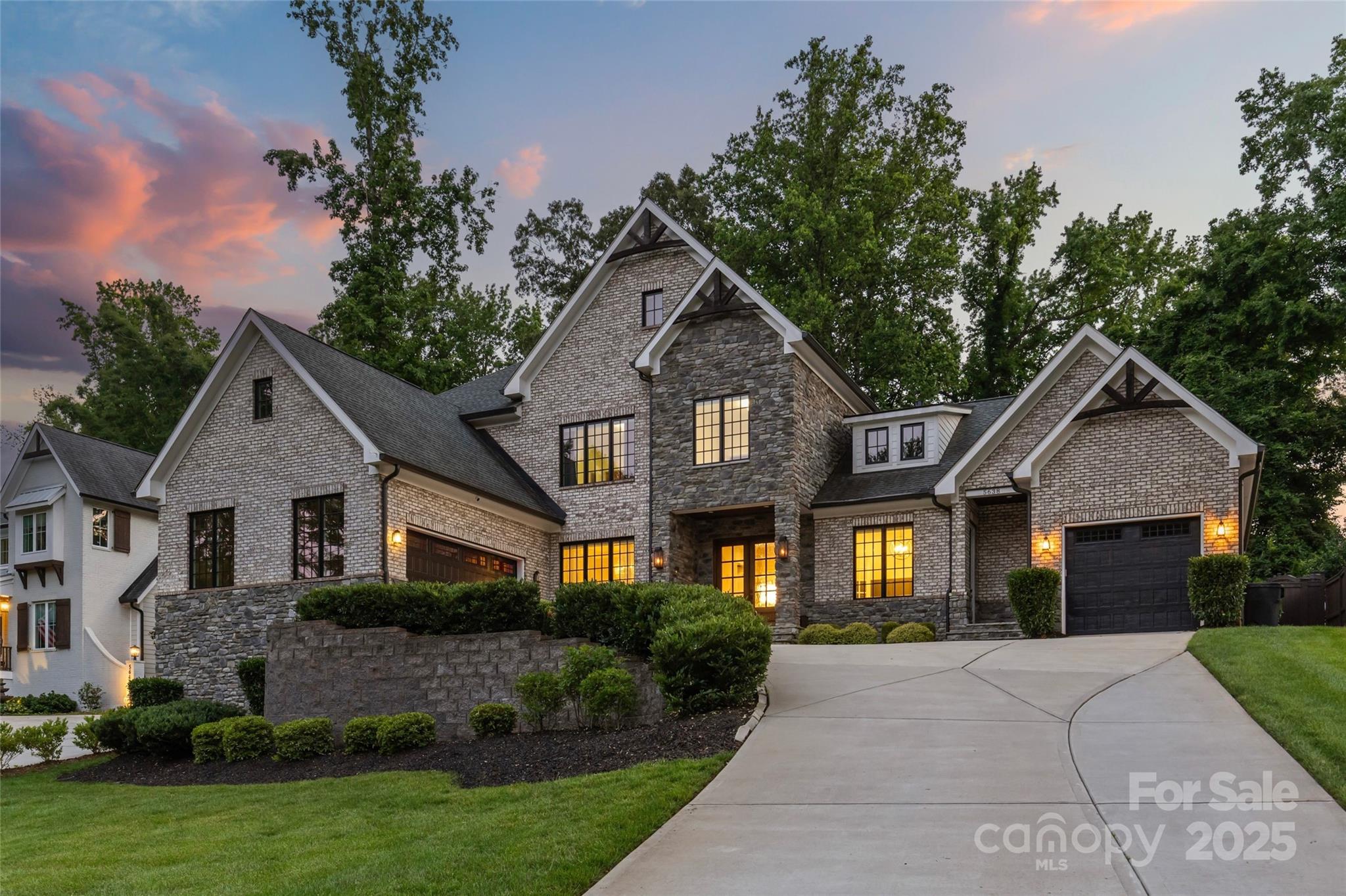 Discover refined luxury in this full-brick 5BD/4FB/2HB Craftsman-Tudor home located in prestigious Mammoth Oaks — just minutes from all the premier shopping, dining, and retail experiences SouthPark and Myers Park have to offer. Inside, you’ll find soaring 10’ ceilings, a vaulted great room, gleaming hardwood floors, in-ceiling speakers, and custom tile and glass showers. The chef’s kitchen impresses with quartz countertops, high-end stainless steel appliances, and a walk-in pantry. The main level includes a spacious primary suite, guest suite, and dedicated home office with nearby half bath. Step outside to your private backyard oasis featuring a pool, outdoor kitchen/bar, lush landscaping, and a 6’ privacy fence. Additional upgrades include solar panels, dual tankless water heaters, and a 3-car garage with extra-tall ceilings ideal for car lifts. No HOA. This home perfectly blends timeless design with modern luxury in one of Charlotte’s most connected locations.