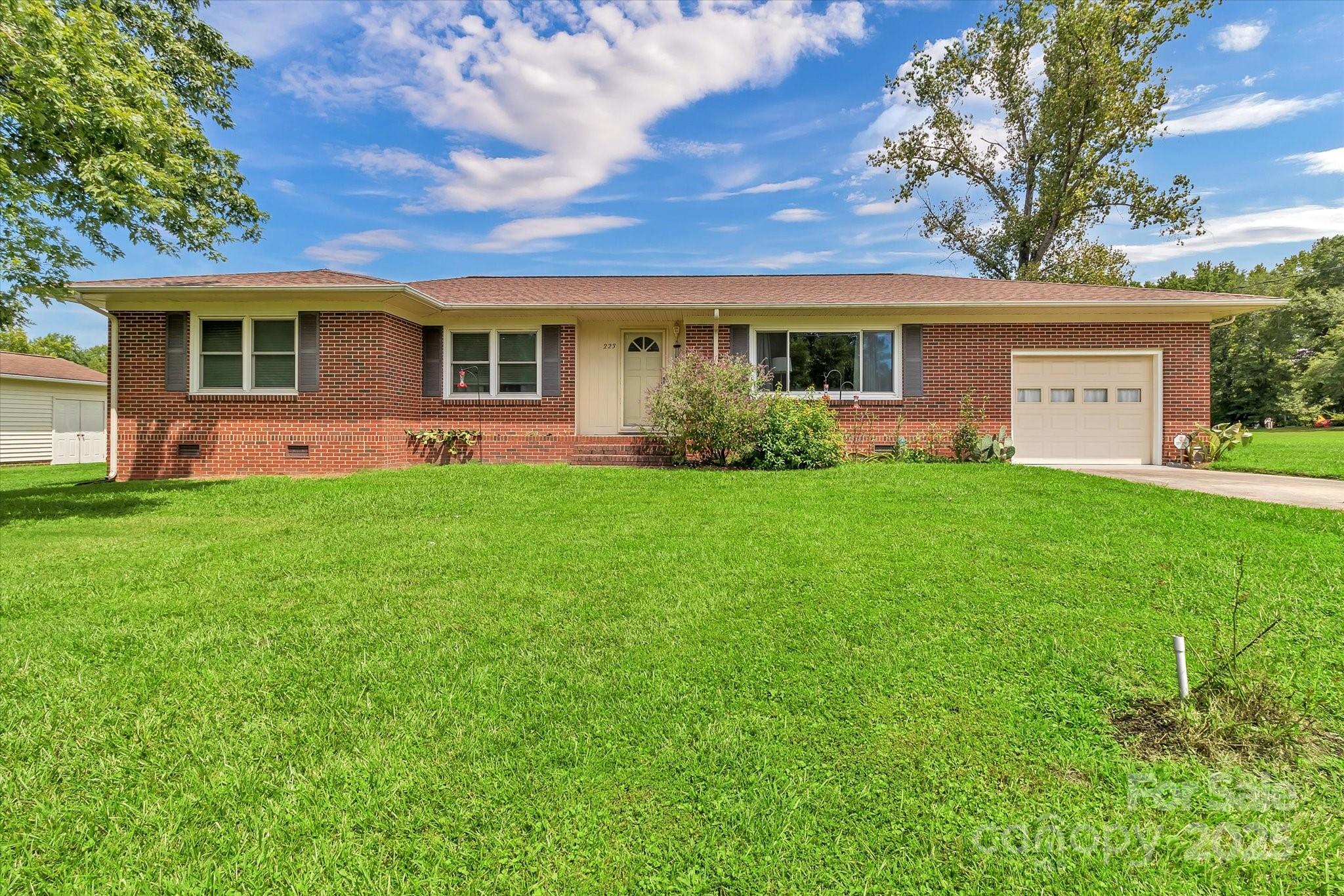 Escape to your own private retreat with this charming 3-bedroom, 2-bath home situated on 5.7 acres of serene countryside. The inviting layout features an updated kitchen with newer appliances, perfect for cooking and entertaining. Step outside to a spacious fenced backyard, complete with an above-ground pool for summer fun. A 1-car attached garage offers convenience, while the 1-car detached garage and workshop provide plenty of space for projects, storage, or hobbies. With ample land to roam and room for future possibilities, this property blends comfort, functionality, and peaceful rural living—while keeping you just a short drive from town.