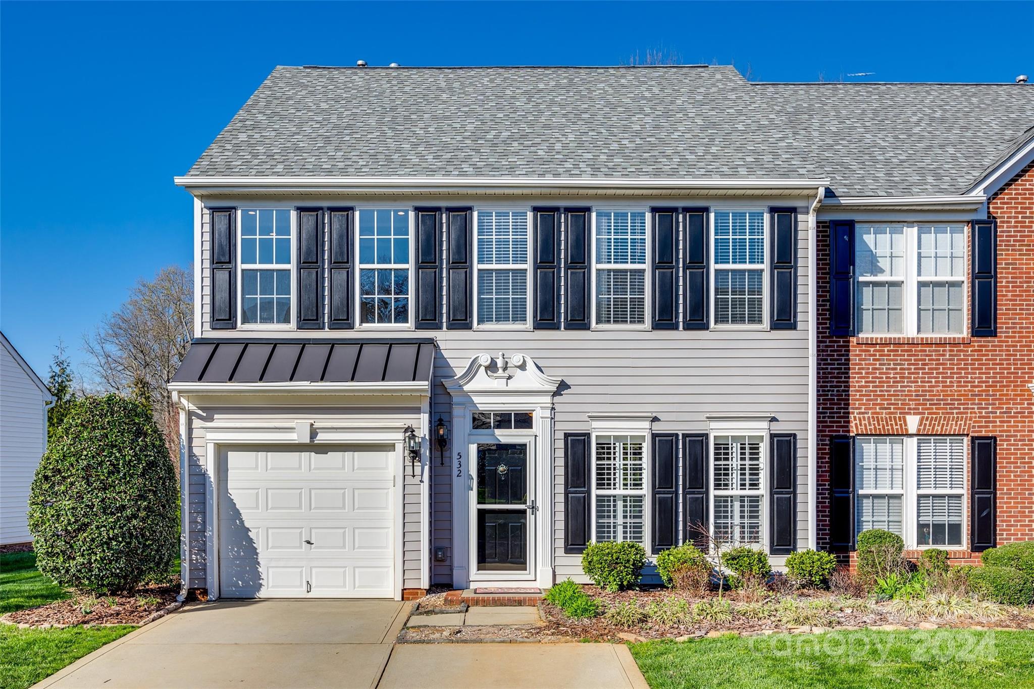 END UNIT townhouse in Fairway Townes in Fort Mill! Step inside to an open floor plan with an abundance of natural light pouring in and move-in ready convenience. The kitchen is complete with stainless steel appliances, granite countertops, and a breakfast bar for casual dining. Unwind in the primary ensuite boasting dual walk-in closets and a spacious bathroom with a charming beadboard accent wall. You'll love hanging out in the fenced, private backyard, boasting a paver patio covered by a retractable awning – perfect for enjoying shade on sunny days. Lawn maintenance is included in your HOA fee and don't forget to take advantage of the community pool, just a short stroll away. Easy access to both I-77 and I-485, top-rated Fort Mill schools and low SC taxes. Don't miss out on this fantastic opportunity to call this townhome yours. Schedule your showing today!