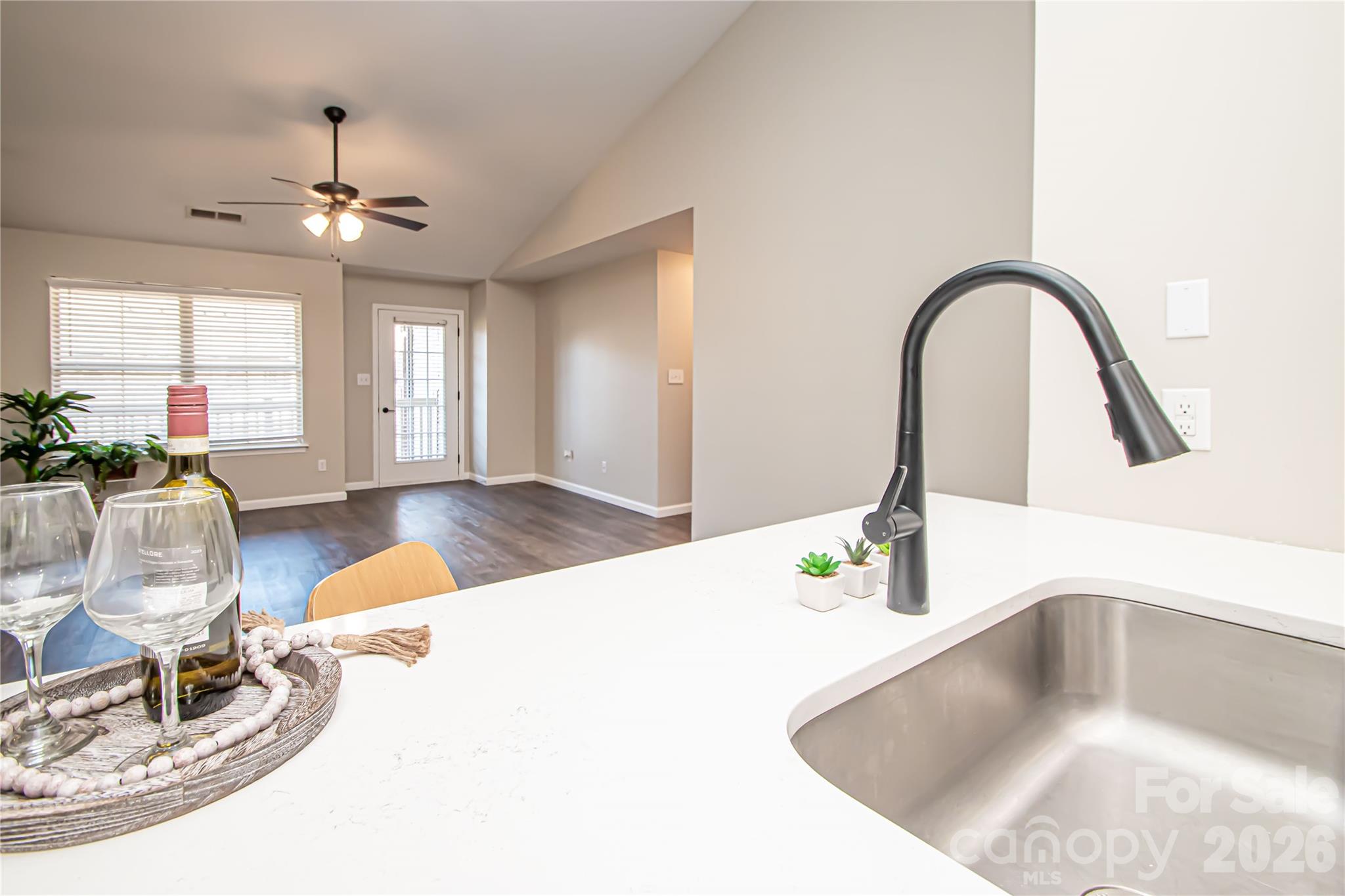 AWESOME NEW PRICE! Move-in ready 2nd floor CONDO in UNIVERSITY AREA and by I-85 exits with stylish 2022 updates and recent 2026 refreshes, offering low-maintenance living and modern finishes throughout. INTERIOR:
• LVP flooring throughout
• Fresh Neutral interior paint; Jan 2026
• No popcorn ceilings
• Black lever door hardware
• 2" blinds
**KITCHEN:
• Two-toned, updated cabinets
• Quartz countertops
• Light Gray Subway tile backsplash
• SS appliance package (yes Fridge (AS-IS) included)
• Farmhouse sink with lighted faucet
• Breakfast bar; large closet that can be used as pantry
** LIVING/DINING AREA:
• Open-concept layout
• Vaulted ceiling
• Ceiling fan.** BEDROOMS/BATHS:  
• Owner suite w/ tray ceiling and 
Walk-in closet w/ attic access
• both Updated bath cabinets w/ quartz vanities
• Garden tub in owners suite
• Ceiling fans with lights
• Updated bathroom mirror, lamp fixtures & finishes
.**EXTERIOR:
• Private balcony; 
• Power washed drive, walk & siding (Jan 2026)
.**GARAGE AND SYSTEMS:
• Attached garage with oversized light
• HVAC replaced 2022 +
A thoughtfully updated home offering modern comfort, recent improvements—ready for its next owner. 3/20