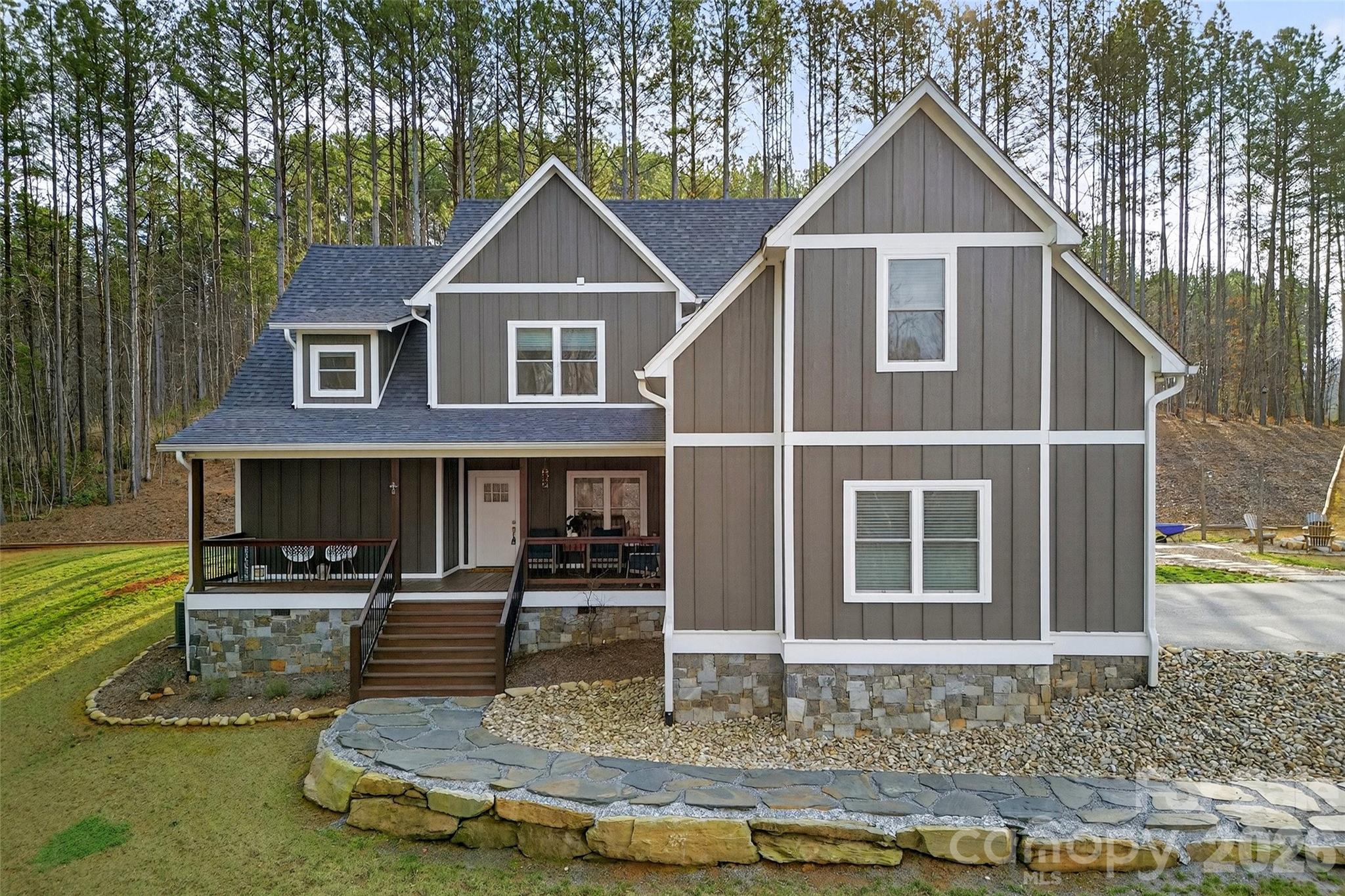 This is the one you’ve been waiting for! Nestled on 3 acres, this beautiful home offers the perfect blend of space, comfort, and charm. The expansive main level features a private primary suite with a luxurious en-suite bath, a vaulted living room with a stunning floor-to-ceiling fireplace, and a spacious kitchen complete with an oversized island—ideal for entertaining. You’ll also love the convenient mudroom and laundry area. Upstairs, you’ll find two bedrooms, two bathrooms, and two additional bonus rooms—plus a hidden gem: a secret bonus room tucked behind a bookcase door! Step outside to the covered back porch, the perfect spot to relax and enjoy the fresh mountain air. Located just minutes from I-40 and downtown Marion, this home offers both convenience and privacy in a serene setting. Discover life in Marion, NC — where mountain views, greenways, waterfalls, Lake James, and charming downtown living come together. Enjoy hiking, scenic drives, local cafés, live events, and outdoor adventure all just minutes from home. Perfect for anyone looking for peaceful mountain-town living with plenty to explore nearby. Don’t miss your chance to make it yours!