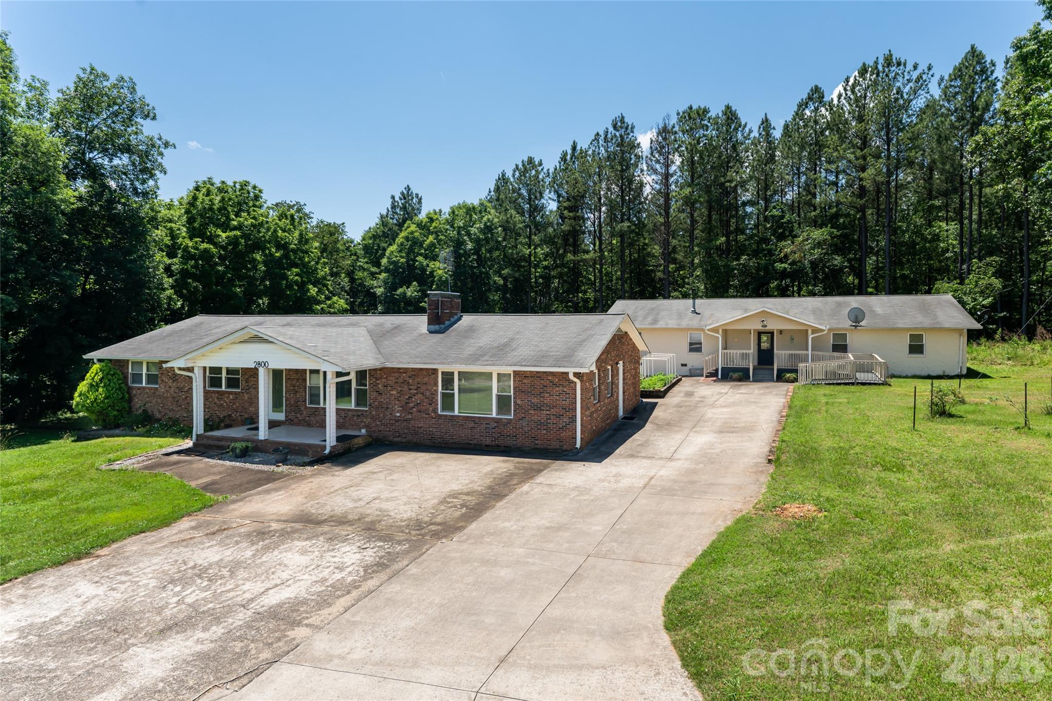 They are endless possibilities when it comes to these two spacious homes under one parcel of land. The home is located minutes away from Tryon International Equestrian Center. Both homes on the property futures open floor plan, large living rooms with open kitchen. Great potential for single family, multi family, rental or commercial opportunities such as live work as Adult Care Home.  Seller has done all inspections and Appraisal for you to appreciate the property that it is priced right. Bring your offer.