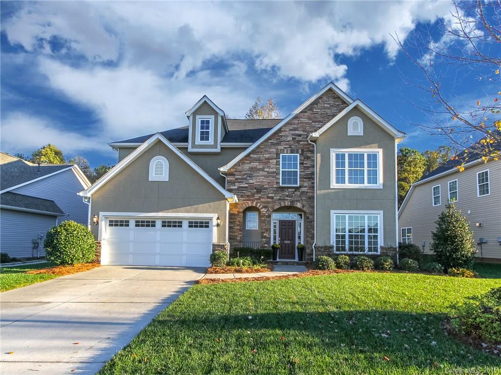 Stunning home in Chastain Village under tax value! Loaded with desirable features, Master on main & open floor plan. Great Rm stone fireplace flows into Kitchen w/wood flooring, 42" cabinets, granite , stainless app's, walk-in pantry. Mud Rm w/built in cabinetry. Master Bath w/dual sinks, sun lamp for cool mornings, dual walk-in closets, separate shower & soaking tub. Upstairs features loft & 4 bedrooms with walk-in closets. Sunroom overlooks  fenced wooded backyard w/patio, full irrigation
