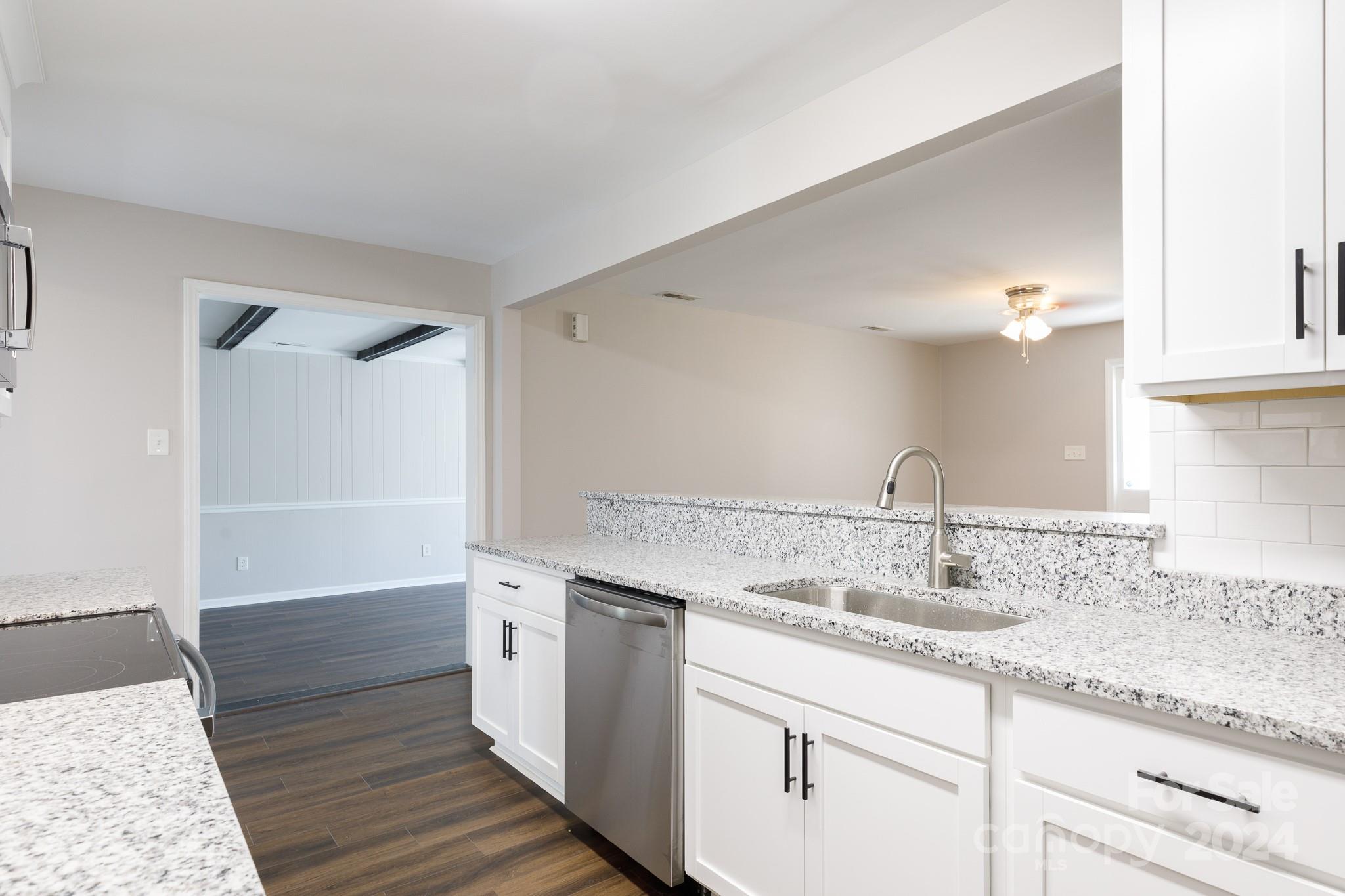 This updated ranch features 4 spacious bedrooms, including a primary suite with a luxurious walk-in closet. The heart of the home lies in the large kitchen, equipped with elegant granite countertops, a convenient breakfast bar, and tons of cabinets for ample storage. A refrigerator is included, making move-in a breeze. Additionally, the home boasts a cozy den for relaxing evenings. Completing the package is a generously sized laundry room, providing convenience and functionality for everyday tasks. Situated in a prime location, this home is just minutes away from shopping and dining options, providing easy access to everyday necessities. This home offers the perfect combination of style, convenience, and accessibility.