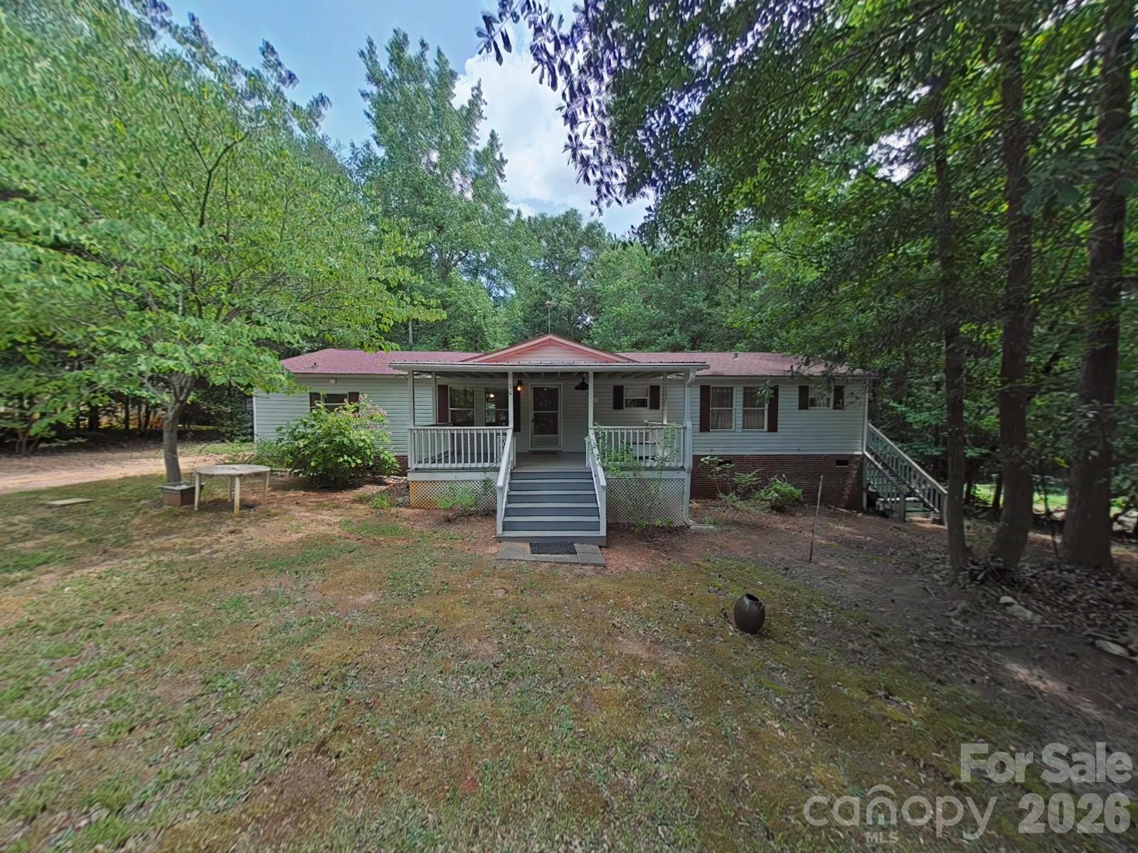 Great home and even greater value!   3 bedroom 2 bath home on 1 acre in the Clover School district.  Located off Barrett Road near Clover Middle School and US 321 to Gastonia and Lake Wylie.  large kitchen and breakfast area attached to a large family and gathering area .  Metal covered front porch for relaxing and listening to the summer thunder storms taping on the roof!  Home is Brick underpinned.  Title is being retired and buyers are welcome to reto-fit the home for an FHA loan.