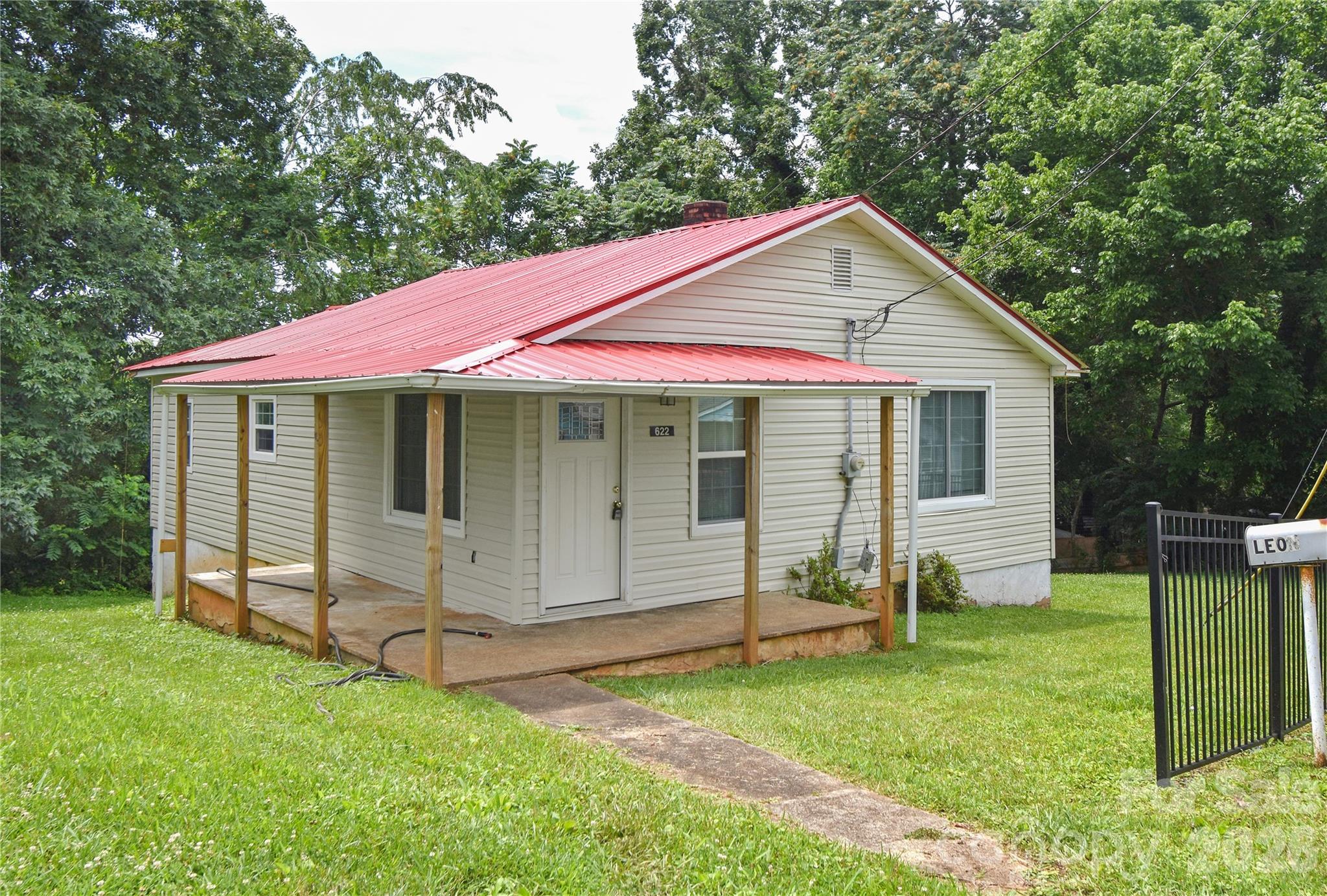 Located in the mountains of Western North Carolina, this updated 2BR/1BA one-level home offers an affordable, move-in-ready opportunity. Conveniently situated just minutes from downtown Marion and Interstate 40, providing easy access to shopping, dining, schools, employment centers, and local amenities. Recent improvements include new cabinets, flooring, interior paint, attic insulation, a new roof installed in 2024, and a heat pump installed in 2022 by the previous owner. The unfinished basement provides additional storage space and potential for future use. Enjoy outdoor living from the newly constructed rear deck, offering a private setting for relaxation or entertaining. A great opportunity for homeowners or investors alike. Schedule your showing today.
