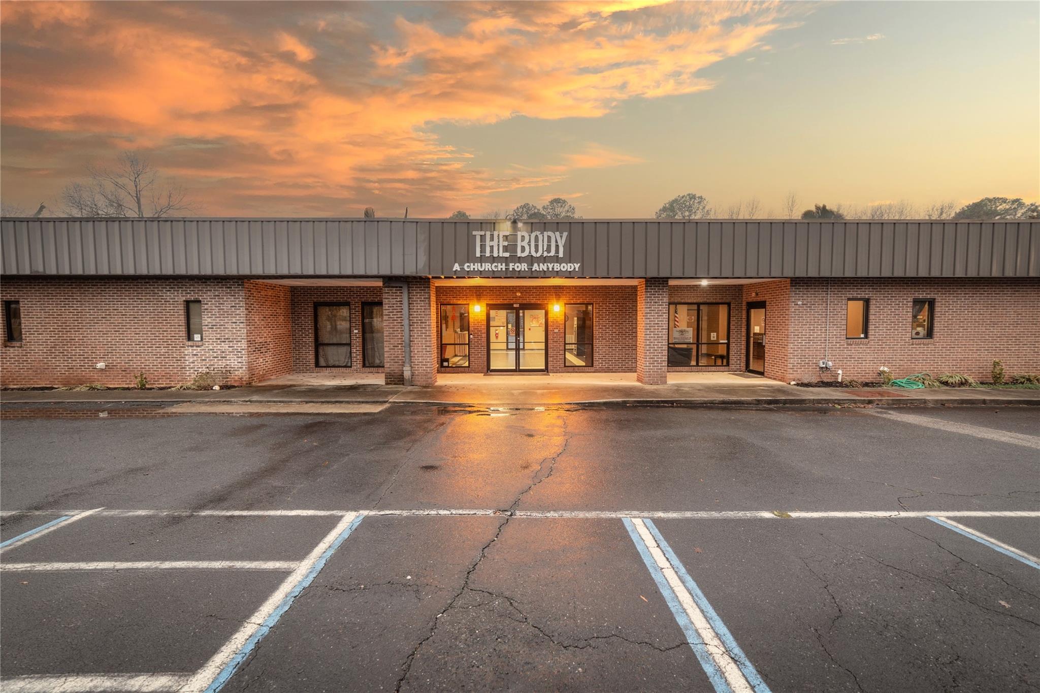 Ready to move in, commercial property located approximately 3 miles from central business district of Rock Hill, SC, easy access to I-77, close to Rock Hill Airport and close to Piedmont Medical Hospital.  No current tax records, owned by 501C3. Could be used for: medical, office, industrial, church, daycare, shared workspace, school or event space. Building originally constructed in 1988 with additions in 1993 and 1996. Total of 80 parking spaces, includes handicap. Wide open area can be used as a warehouse, office workspaces or event center. Some special features of the property include a coffee shop, large, beautiful kitchen (remodeled in 2016) 2 large open entrances allow separating spaces, handicapped bathrooms, sound booth or nurses station, small, fenced area in back of building, great for an employee area, or playground and wooded lot. Agent to verify city restrictions for zoning. Great building, great property size and great location. Listing Agent is related to Pastor.