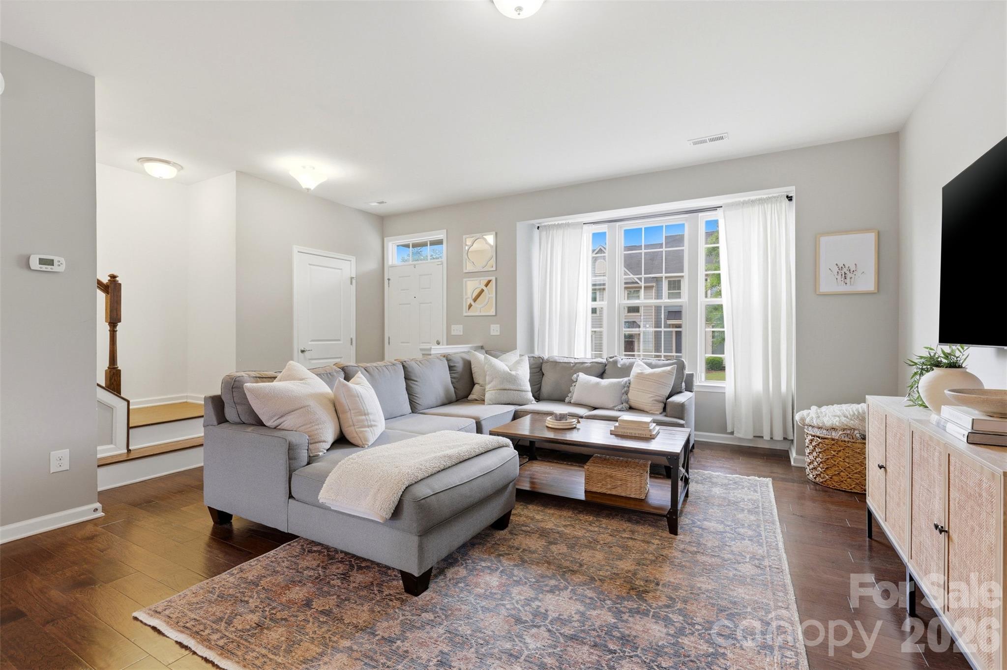 Immaculately maintained and move-in ready, this charming Bryant Park townhome checks every box AND has an opportunity for $10,000 in grant money for qualified buyers. Nestled in one of Charlotte's most sought-after neighborhoods, 1714 Evergreen Drive offers 3 bedrooms, 3 baths, and 1,796 square feet of thoughtfully designed living space. The open main level shines with hardwood floors, a well-appointed kitchen featuring a center island, dark cabinetry, stone counters, and stainless appliances. Upstairs, a generous primary suite with walk-in closet provides the retreat you've been looking for. Step outside to a private rear patio, perfect for morning coffee or evening unwinding. Two parking spaces included. All of this, walking distance to Noble Smoke, Rhino Market, neighborhood coffee shops and less than 10 minutes to Uptown. Bryant Park living at its best.