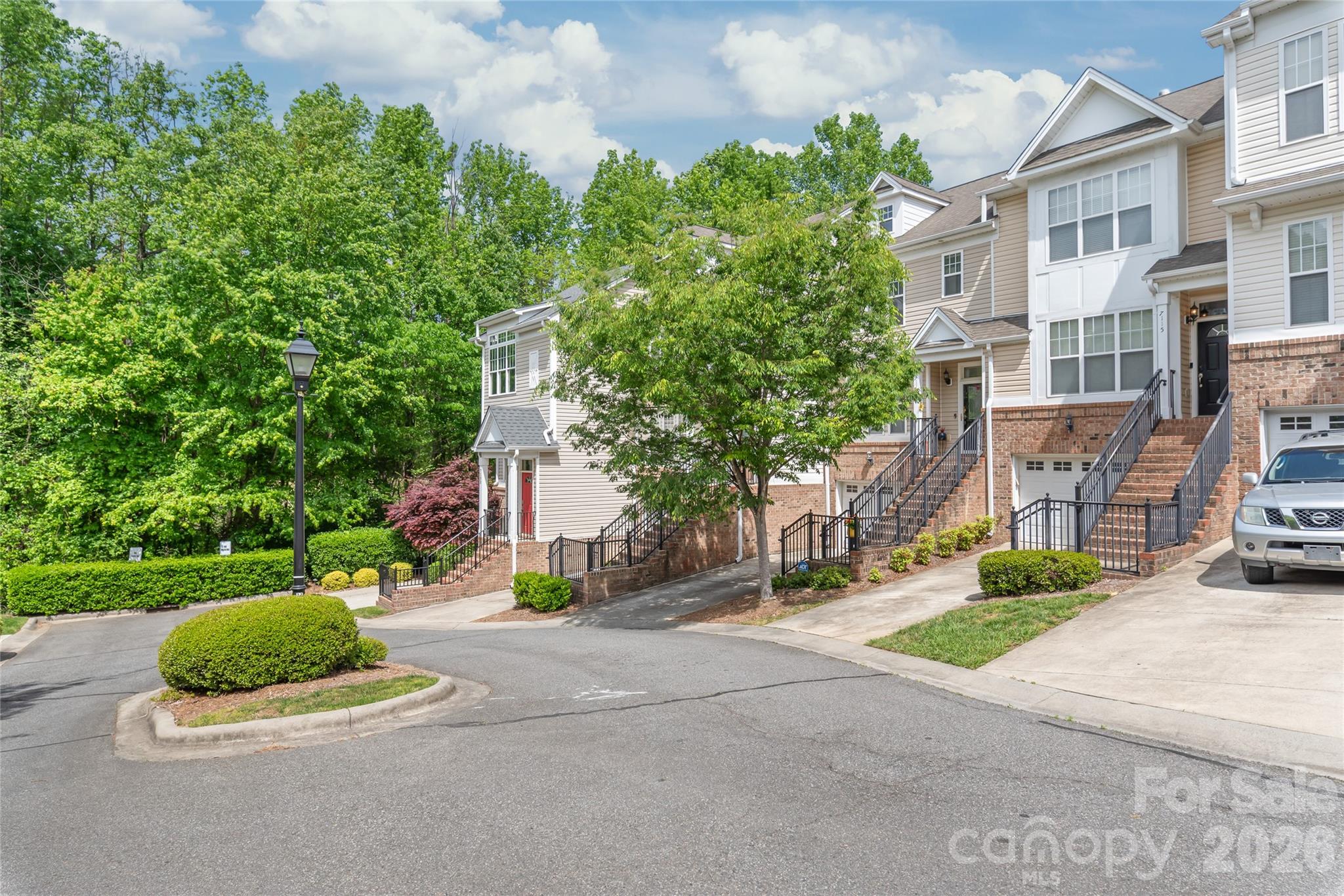 Imagine stepping into your front door and immediately feeling the peace and warmth of your home. That is exactly what 7111 Founders Club Court feels like.  This townhome is located in the Highland Creek community where you are surrounded by lush golf courses, plenty of neighborhood parks, walking trails, sports courts and pools. The home itself features three levels of living space with a garage and bonus room on the first level with a walkout patio; the main level features a flowing layout with a living room, formal dining room, kitchen, and a private deck with retractable screens and views of the golf course; the third level features three bedrooms, including the primary suite (walk-in closet, double vanity and shower only bathroom) and an full additional bathroom. The current owner has replaced all the carpeting upstairs as well as the hickory hardwood floors on the main level, HVAC unit (2022) and the hot water heater (2025). HOA includes water, trash, exterior maintenance, landscaping, access to all community amenities: golf, pools, fitness center, tennis courts.

This home is conveniently located at the border of Charlotte and Concord making your commute super easy and your lifestyle amenities very close. Access to I-485 and I-85 are less than 7 mins away. Lowe’s, Walmart, Concord Mills are less than 5 mins away.  Schedule your private tour today and imagine yourself in your new home, 7111 Founders Club Court.