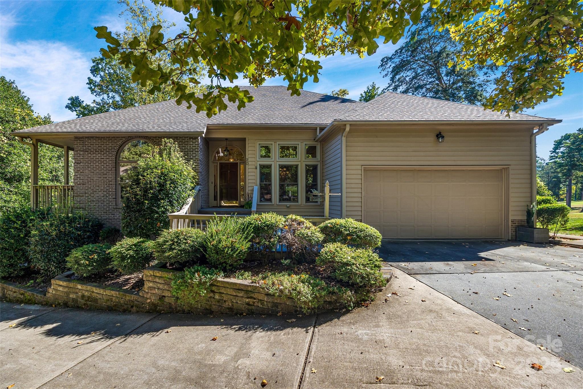 Welcome home to 20 Pine Knoll Lane and living close to the lake and the golf course.  This home has it all.  3 bedrooms on the main floor including the primary bedroom, bathroom, dual closets and a sitting area.  Split bedroom plan.  Oversized deck, screened porch, 2 story great room with lots of windows and who needs an extra 4 car garage /workshop with separate entrance.  This is the wood worker workshop dream space!  and a 1/2 bath downstairs.  Great room and 2 additional living spaces in the loft (could be 4th bedroom) and formal living room, or flex space.  2 car garage on main floor with more storage.   River Hills neighborhood offers a marina, country club with 2 pools, 18 hole championship course, tennis and pickle ball courts.  These are separate fees.  Neighborhood offers dog park, waterfront park with sandy beach and picnic pavilion, gardens, playgrounds and miles of walking trails.  And of course in the award winning Clover School district.