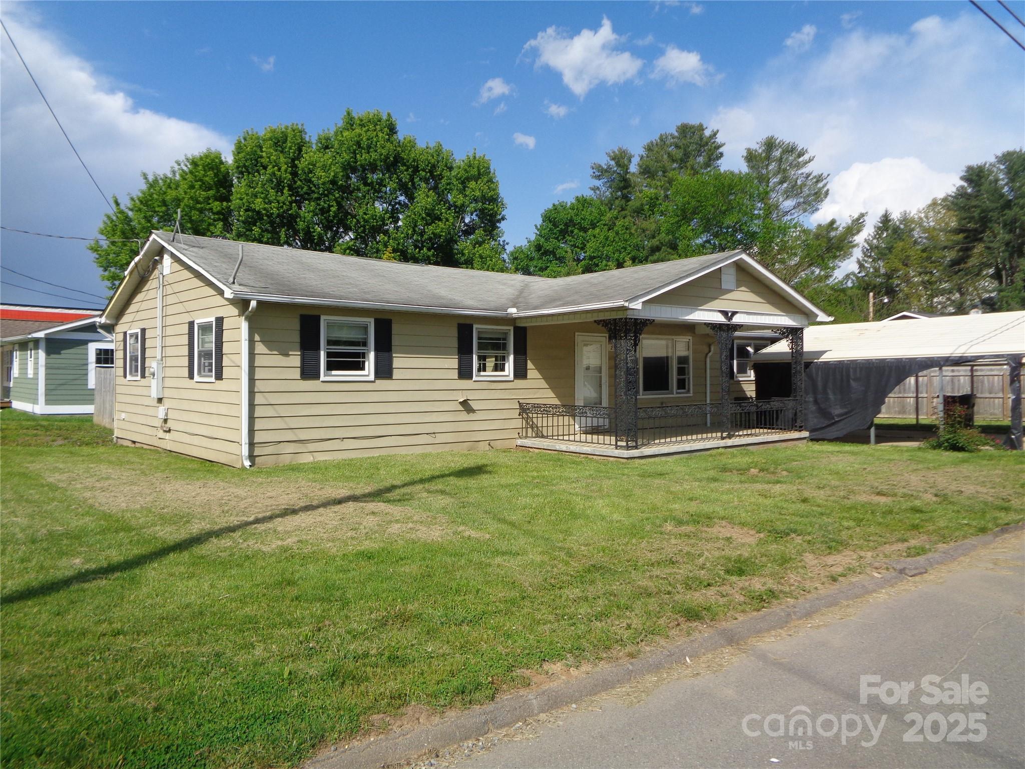 This property was flooded during Helene and is located in the 100 year flood plain. Located close to downtown Waynesville, this home sits on a city corner lot with lots of potential. This is your opportunity to add your personal finishes and touches. A great full time home, vacation home, or rental property. A must see for an investor or builder.