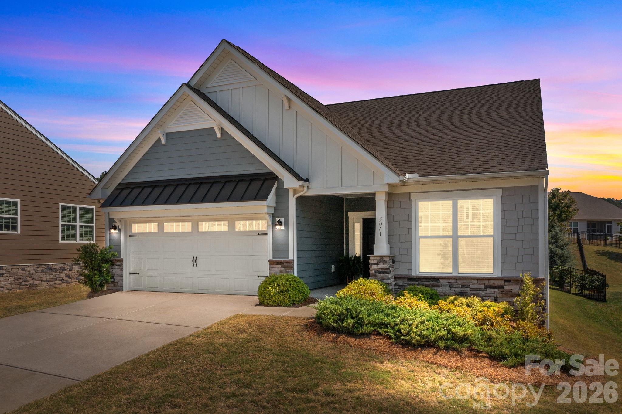Welcome to this beautifully maintained 2BD 2BA home in the highly sought-after, amenity-rich community of Imagery on Mountain Island Lake. Designed w an open-concept layout, this home is perfect for both everyday living & entertaining. The spacious kitchen features premium granite countertops, a gas range, & a large island that flows seamlessly into the dining & living areas. A versatile den w French doors offers the perfect flex space for a home office, guest room, or hobby area. The primary suite has a double vanity sink, walk-in shower w built-in bench, & an oversized walk-in closet. Step outside to enjoy a covered porch, complemented by beautiful hardscaping & built-in bench and fully fenced back yard. The freshly painted garage with an epoxy floor adds both style & durability. Enjoy a quiet Cul-de-sac with easy access to trail head. Living in Imagery means embracing a lifestyle. Enjoy access to the lakeside beach, scenic walking trails around Mountain Island Lake, and an impressive lineup of amenities including a resort-style pool, clubhouse, fitness center, yoga studio, ceramics studio, and marina. This is more than a home—it’s a lifestyle you don’t want to miss!