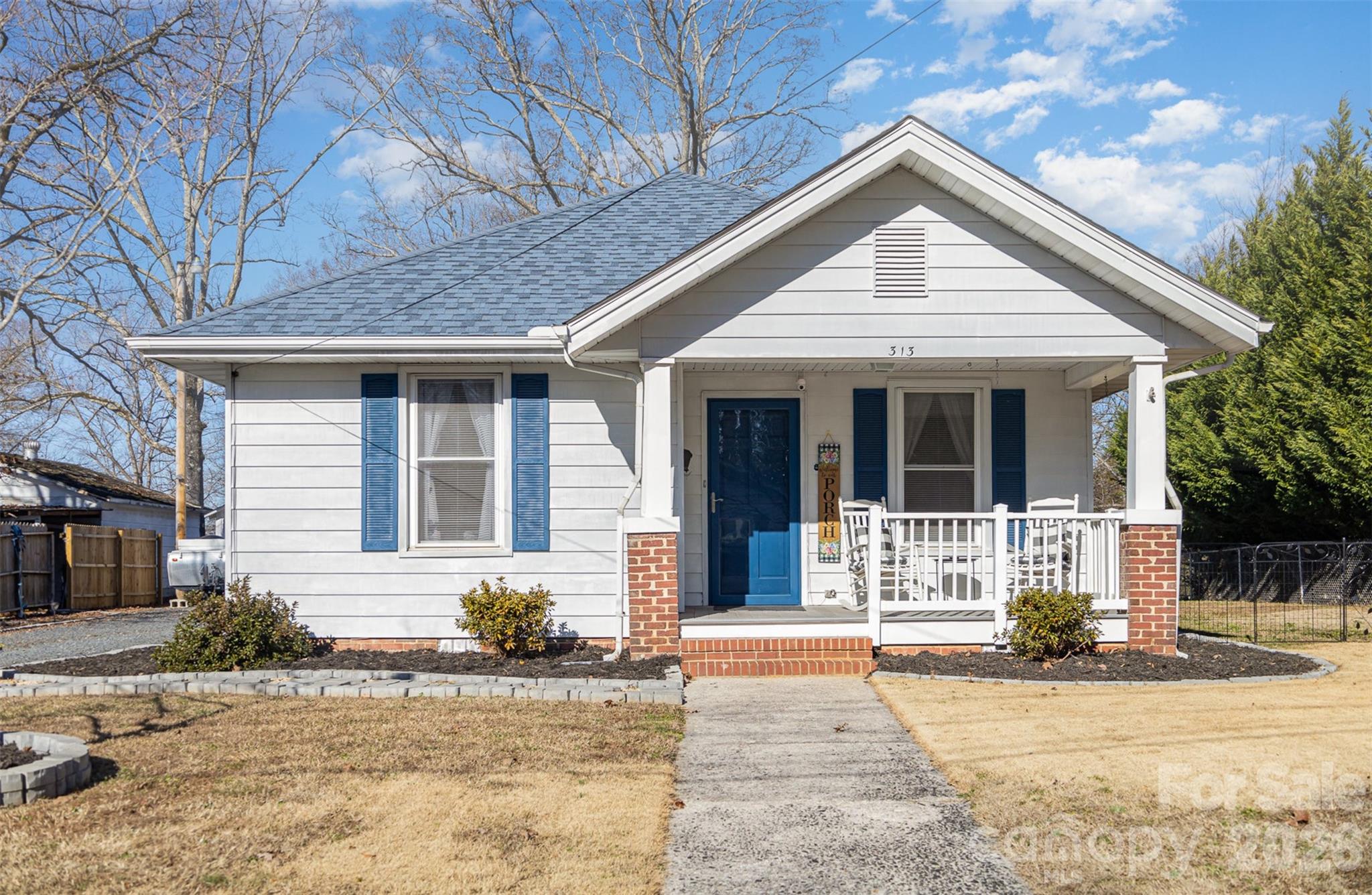 Take a moment to appreciate the charm of this exquisitely renovated contemporary farmhouse that has been meticulously designed. From the 2023 HVAC system, a new tankless water heater, 2023 roof and all plumbing and electrical work has been updated. Some amazing kitchen features include a large island with a pullout for additional seating, a coffee bar with shiplap background, renovated kitchen with a ceramic tile backsplash, and granite countertops. All stainless steel appliances. A beautiful barn door leading into the closet in the living room. The entire house has luxurious vinyl plank flooring. A lovely long driveway that leads to a one car detached garage, carport for 2 and 3 additional garage/ workshops. A very attractive and well-maintained front and backyard oasis with covered screened in sitting area with lots of seating , fire pit area and two person hot tub.Washer/Dryer included with acceptable offer.