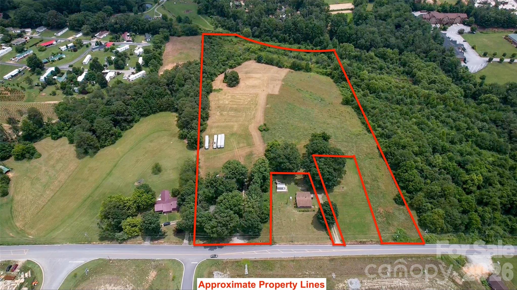 Rare opportunity to acquire over 14 acres of industrial-zoned land in one of Henderson County's most desirable commercial growth corridors. Located just off Exit 53 of Interstate 26 with easy one-turn access from McMurray Road, this highly visible and conveniently positioned tract offers exceptional development potential. The property is relatively level, making site preparation and future construction more cost-effective. City water and sewer are available, providing valuable infrastructure for a wide range of industrial, warehouse, distribution, manufacturing, contractor, or commercial uses. Industrial-zoned tracts of this size with public utilities are becoming increasingly difficult to find in Henderson County. Conveniently located between Hendersonville and Asheville with quick access to Interstate 26, this property offers the ideal combination of accessibility, utility availability, and development potential. Whether you're an owner-user, investor, or developer, this is a rare opportunity to secure a premier commercial tract in a rapidly growing area.