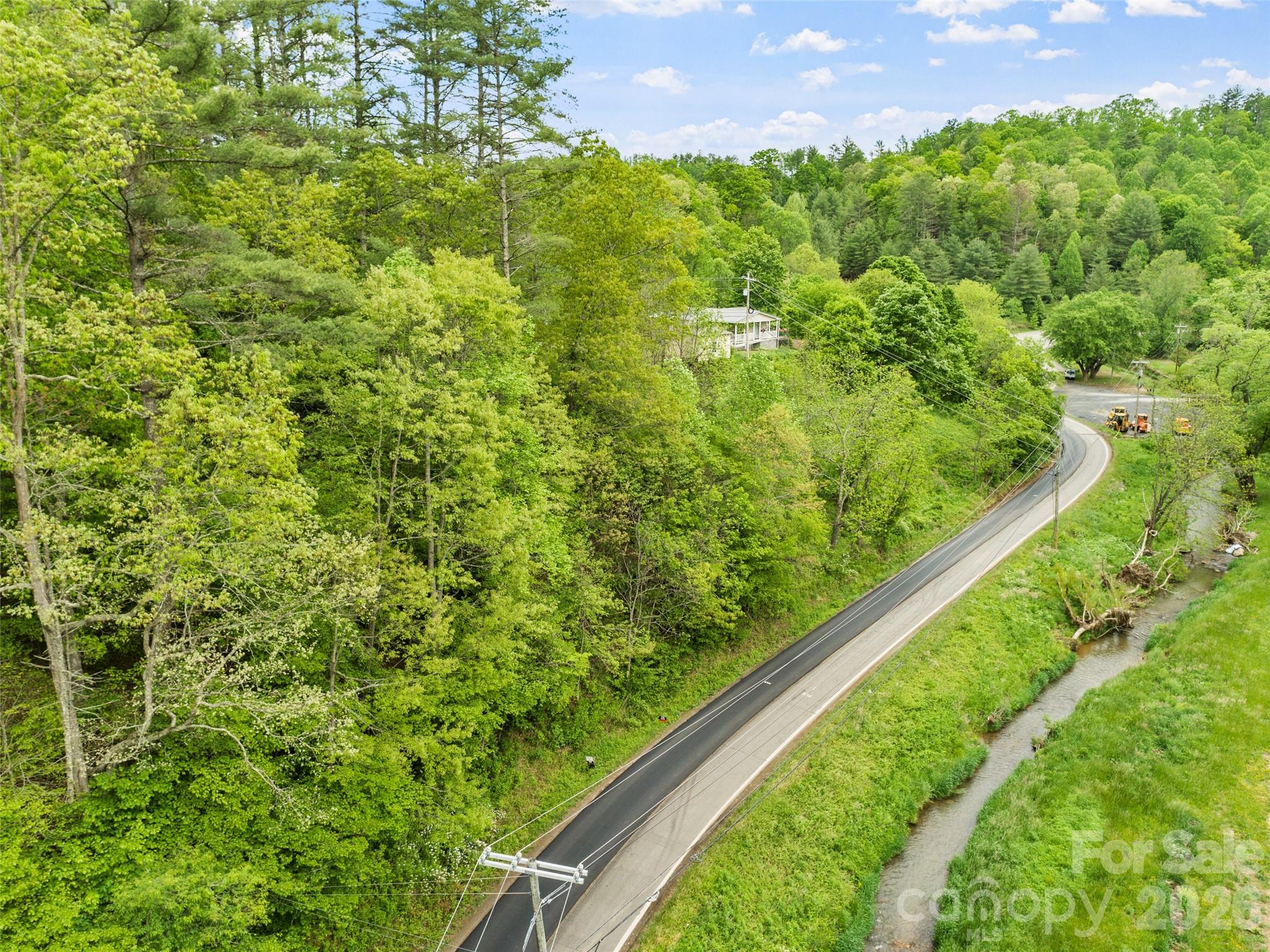 Discover the freedom to build your dream home, start a mini-farm, or create the private retreat you’ve always imagined! Located on sought-after Jacks Creek Road, this 7.91-acre property offers direct, easy access from the road—no winding mountain roads to navigate. With no restrictions, your vision can become reality—whether it’s a cozy cabin, a modern farmhouse, RV setup, or investment opportunity.

Enjoy convenience with dual access points from both Green Mountain Road and Jacks Creek Road, making it ideal for easy entry and future development. Surrounded by the beauty of Western North Carolina’s rolling landscape, yet just minutes to town amenities, this property truly offers the best of both worlds—privacy, freedom, and accessibility.

Opportunities like this don’t come often. Bring your dreams to life on Jacks Creek Road!