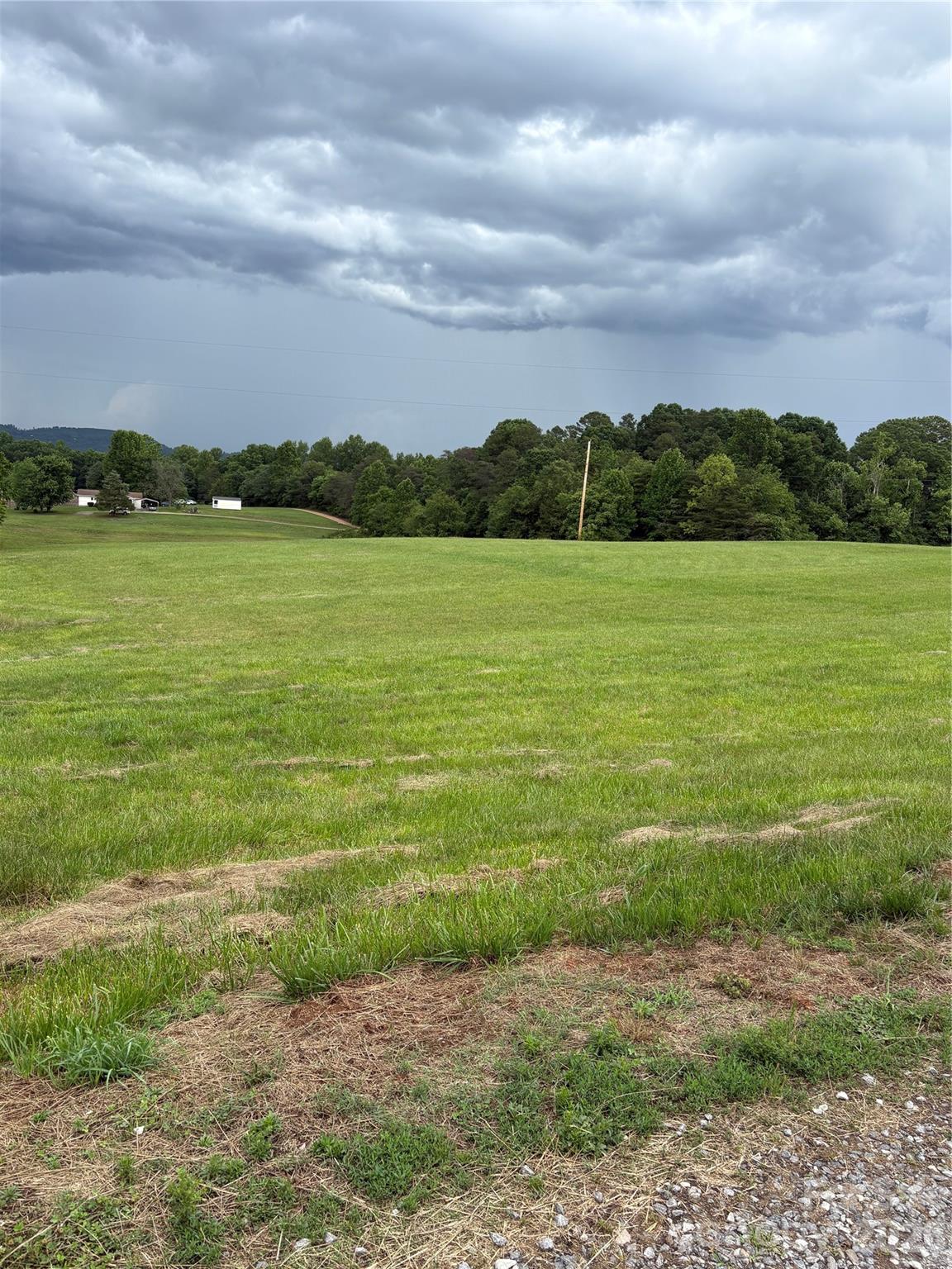 This 2.3 acre lot with its open space is located in a very peaceful and serene area in Northern Iredell County.  The land has a gentle slope from the front of the property to the backside.  The potential development options one has with this property are endless.  Travel to Statesville and I-40 are approximately 15 minutes away.  A very nice large Convenience store with gas station is located only minutes away.