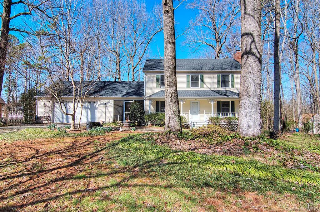 Traditional home in the heart of Fort Mill walking distance to the new Riverview elementary school. Rocking chair front porch spans front of house. Beautiful wood floors welcome you as you enter the home. Spacious, yet cozy living room with brick fireplace, Breakfast room has bay window that over looks deck and private fenced back yard. Laundry room/Mud room off of kitchen opens to screened breezeway and leads to garage.  Garage is oversized with workshop and separate storage.