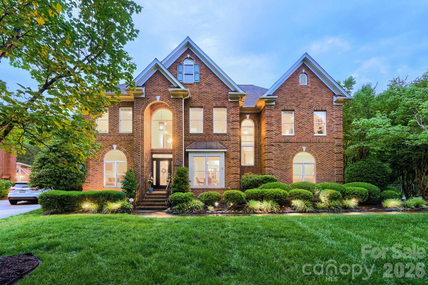 Located in the highly desirable Providence Country Club community, this beautifully full brick updated home in a quiet cul-de-sac offers modern upgrades, timeless comfort, and move-in-ready convenience in one exceptional package. Designed with an open and inviting floor plan, the home offers effortless everyday living and seamless entertaining, all just minutes from premier shopping, and dining. 

At the heart of the home is a stunning, fully renovated gourmet kitchen thoughtfully designed for both style and functionality. Features include refreshed cabinetry and tile, custom pull-out storage throughout, elegant granite countertops, and an oversized two-level island with extensive storage and built-in electrical access. A wraparound bar-height counter creates the perfect gathering space for family and guests. Premium appliances and smart upgrades include a KitchenAid five-burner gas cooktop with downdraft ventilation, stylish range hood, pot filler, motion-sensing Moen faucet, instant hot water dispenser and built-in microwave with wave sensor technology. The oversized walk-in pantry is beautifully customized with ample built-in shelving and drawers and finished with a stylish sliding barn door. This home is filled with thoughtful modern touches throughout, including smart-home features, updated designer lighting with dimmers and built-in nightlight functionality, outlets above cabinetry for cameras, lighting, or Sonos speakers, and a screened porch door with integrated adjustable shades for year-round comfort and patio speakers.

Extensive recent improvements provide peace of mind and true turnkey living. Major updates include a new architectural shingle roof, steel gutter guards, E-shield attic insulation, humidity-activated attic ventilation fans, Nest smart thermostats for enhanced comfort and energy efficiency, updated crawl space vapor barrier and insulation, and a multi-zone irrigation system with a Rachio WiFi smart controller.
Inside, hardwood floors on the main level, a guest bedroom with a beautiful updated full bath, ideal for grandparents or visitors, stunning all-LED lighting, and updated fixtures throughout create a fresh, modern aesthetic look. Enhanced lighting upgrades span the foyer, dining room, kitchen, family room, and double stairways. Upstairs are four spacious bedrooms and three baths, including a primary suite anchored by a spa-inspired bath, large custom closet, built-in speakers, and motion sensor lights. A secondary upper bath features heated floors and a timer, while a spacious bonus room provides endless entertainment possibilities with a custom bar lounge. The entire space is complemented by designer-style switches and contemporary finishes throughout the home.
The oversized 3-car garage is equally impressive, featuring soaring ceilings, built-in storage shelving, newer garage door openers, sensors, motion-sensor lighting, EV charging capability with a 50-amp connection, and digital keyless entry access. Additional curb appeal and convenience come from the elegant leaded-glass front entry door with sidelights, along with keyless access at both the garage and patio doors. Beautifully maintained and extensively upgraded, this exceptional home offers the perfect combination of luxury, comfort, technology, and enhanced everyday functionality — truly a rare move-in-ready opportunity in one of the area’s most sought-after neighborhoods. https://youtu.be/1ox14GRl7SY