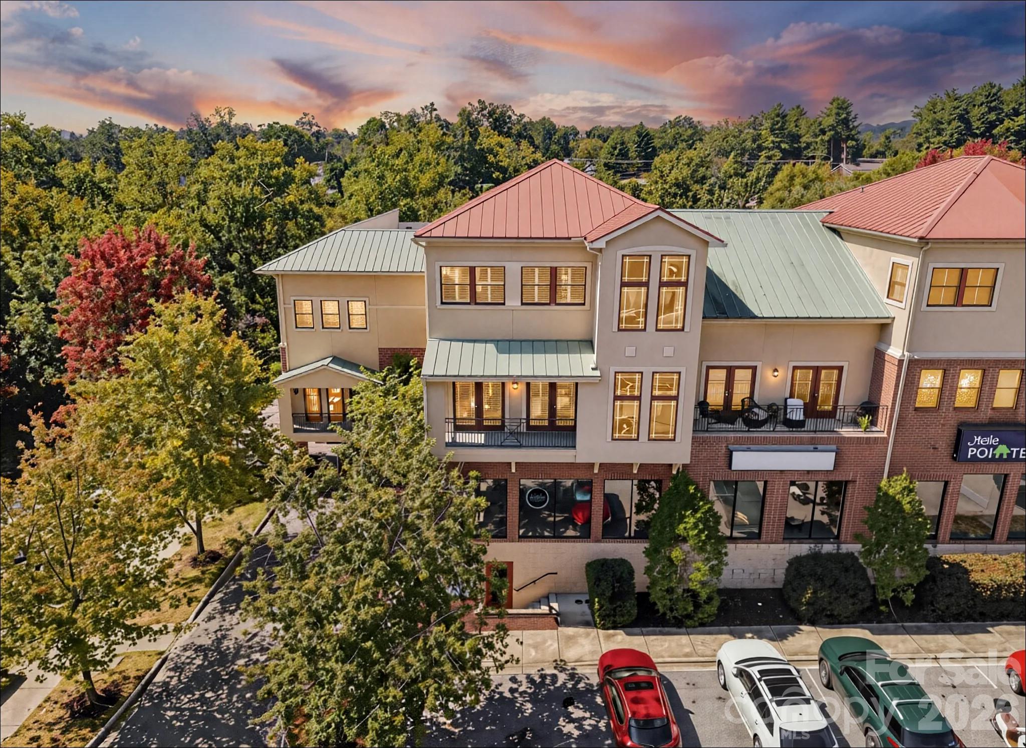 Downtown Hendersonville Condo | Steps to Main Street & the Ecusta Trail

Enjoy the best of downtown living in this spacious two-story condo just one block off Main Street. Offering 2 bedrooms, 3 full bathrooms, and over 2,100 square feet, this home delivers comfort, flexibility, and an unbeatable location. Whether it’s morning coffee, dinner with friends, or a quick walk or bike ride on the Ecusta Trail, everything you love about Hendersonville is right outside your door.

The main level features an open, easy-flow layout with a generous great room, dining area, and kitchen designed for everyday living and entertaining. A full bathroom on this level adds flexibility for guests, a home office setup, or convenient main-level living.

Upstairs, you’ll find two private bedrooms, each with access to a full bathroom, creating an ideal setup for guests, roommates, or a comfortable primary suite. Large windows throughout bring in abundant natural light and enhance the inviting feel of the home.

Additional highlights include covered parking in the attached garage and true walkability to restaurants, shops, and grocery options. With its low-maintenance design and prime location, this condo is perfect as a full-time residence, lock-and-leave second home, or weekend retreat.

If you’re looking for a place where you can park the car and fully enjoy the downtown lifestyle, this one checks all the boxes.