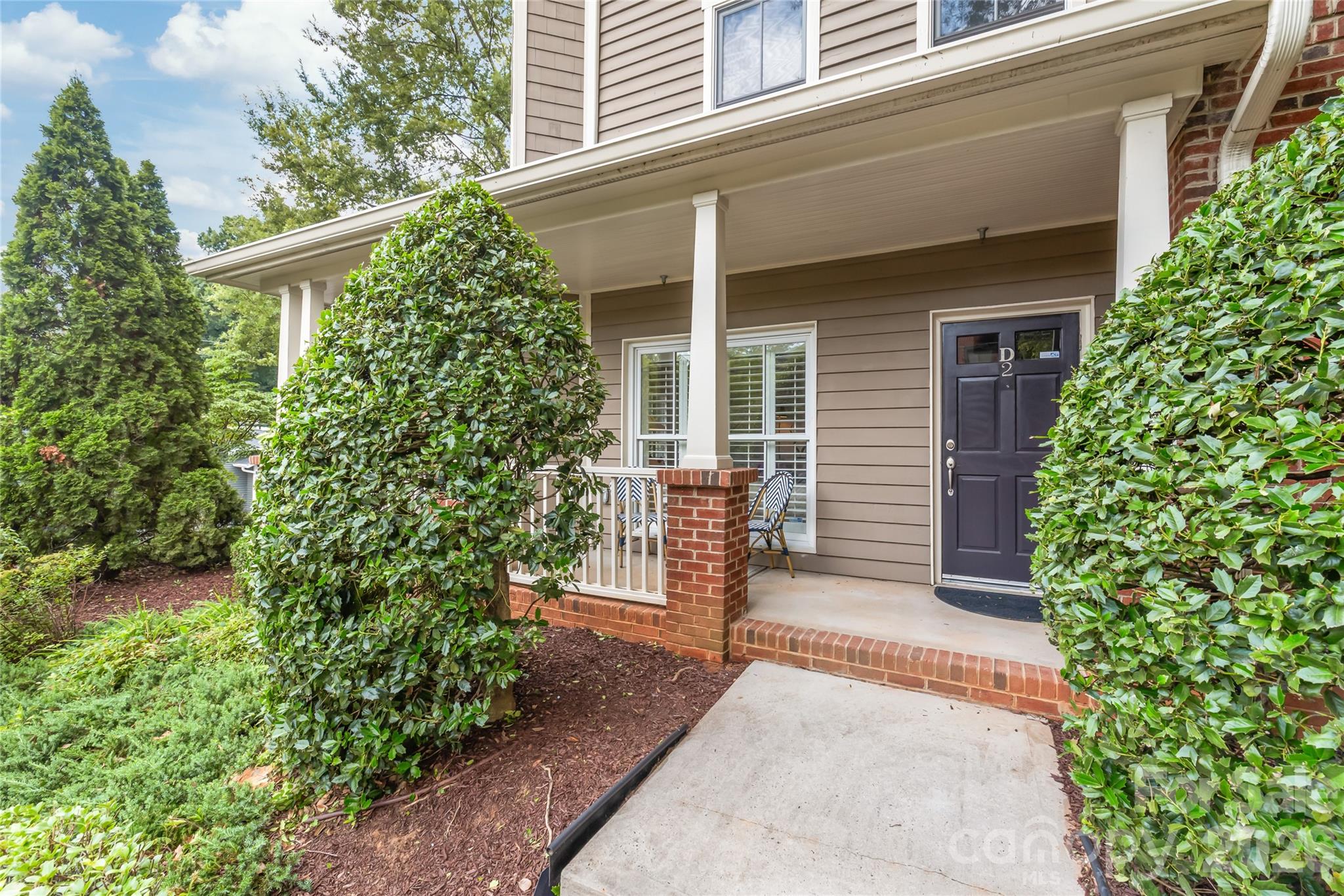 Tucked away in the heart of Dilworth, this first floor condo offers the perfect blend of charming Dilworth with quick easy access to the bustle of SouthEnd. From the moment you step inside Unit D2, you’re greeted by an airy, open layout flooded with natural light and accented by beautiful floors that flow throughout the home.

This is a true gem with thoughtfully designed spaces for comfort and functionality. The refreshed open kitchen features a peninsula with bar seating, quartz countertops, and all new stainless steel appliances that make cooking a breeze. It opens seamlessly into a spacious living area, making it an ideal setup for hosting friends or enjoying a quiet evening in. Retreat to the primary suite, where you’ll find a generous layout and a beautifully updated bathroom (2026) that feels like a private spa. Floor-to-ceiling windows, custom shutters, and a custom closet, too! (King bed featured in the photos). Rear entryway hall hosts a private powder room that's tucked away; hallway leads to dedicated off-street parking.

One of the standout features of this home is the private front porch—a perfect spot for a morning coffee or an evening drink while soaking in the vibrant energy of the neighborhood. With high ceilings and thoughtful architectural details at every turn, this residence feels far more expansive than your average condo. 

Hard to beat this size and location for the price point! You’re just a stone's throw away from Dilworth Tasting Room, Atherton Mill, and the Rail Trail. The condo features one off-street parking spot (space #9) located behind the building. Unlike other condos, there is plenty of interior storage here + a separate/private onsite storage unit. Quick and easy first floor exterior access/entry. Schedule your showing today and make this Dilworth beauty your new home!
