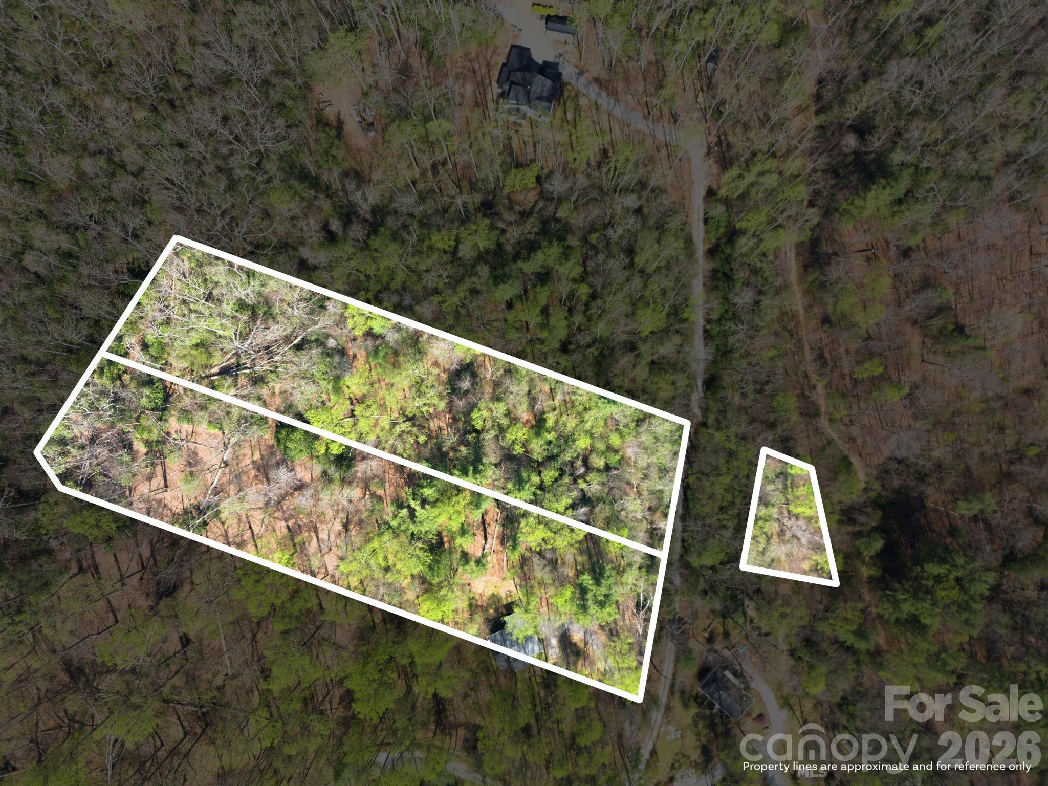 Set within the peaceful beauty of Western North Carolina, Lots 35 & 36 on Lazy Bear Trail offer a rare opportunity to own a generous slice of mountain serenity. These adjoining homesites provide added privacy and flexibility—perfect for creating your dream retreat, whether you envision a cozy cabin getaway or a full-time residence surrounded by nature.

Set among mature hardwoods and gentle terrain, the property invites you to design a home that blends seamlessly with its natural surroundings. Enjoy the quiet rhythm of the mountains, with potential for seasonal views and the calming presence of native wildlife.

With two combined lots, you’ll have the space to spread out—ideal for additional outdoor living areas, a guest cottage, or simply preserving the extra buffer of privacy that’s so hard to find.

Conveniently located within reach of local amenities, yet far enough to feel like a true escape, this property captures the essence of mountain living—peaceful, private, and full of possibility.
