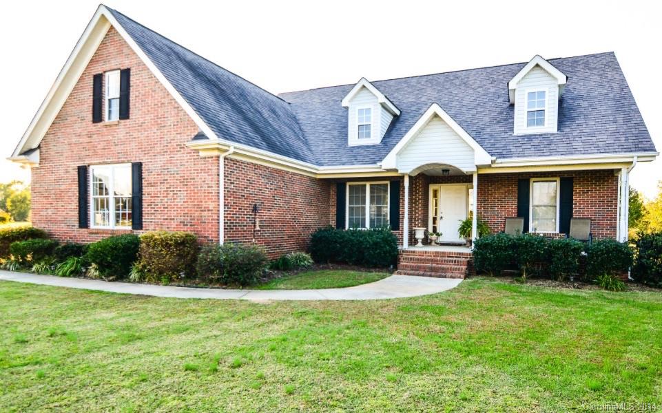 Move in ready! Three bedrooms with a bonus room that can be used as a large bedroom upstairs.  Open floor plan, lots of windows for views of the flat backyard. Perfect for entertaining or relaxing. Hard to find a lot this beautiful! Quaint neighborhood nestled in Rock Hill. Garage/storage building/workshop is 620 square feet of roughed in space. Use as a garage for a third vehicle or as a place to store tools, etc. Home has closet organizers and custom cabinetry in laundry.
