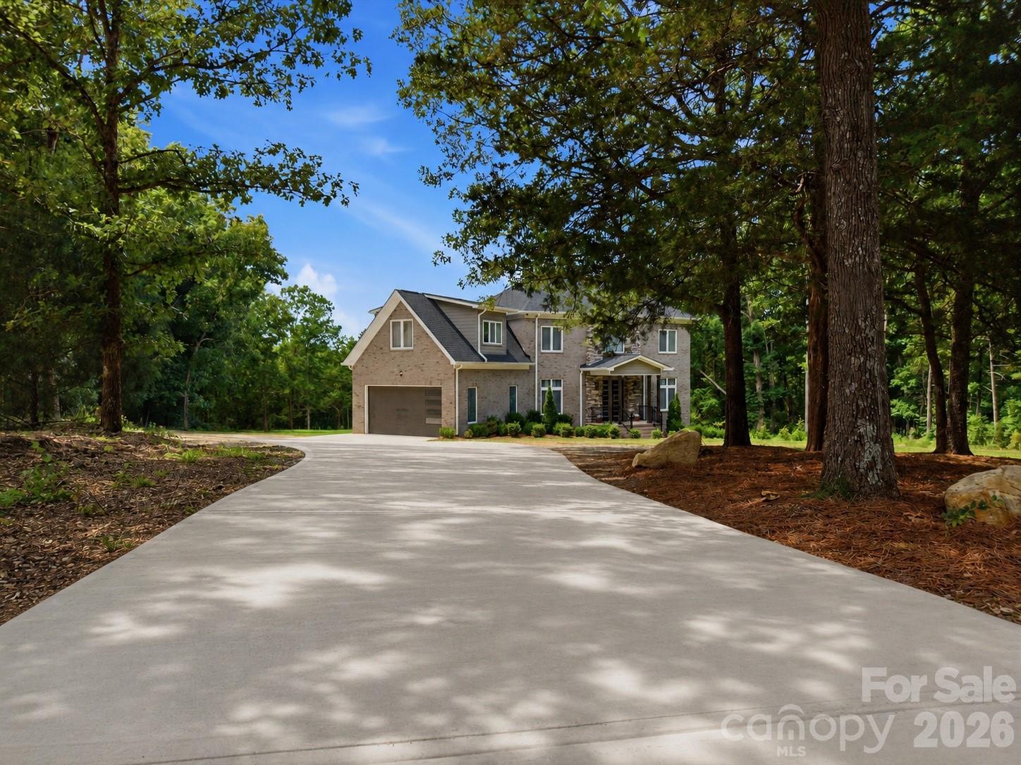 Motivated seller says bring all offers! Where else can you find nearly 4 acres of private country living with no HOA just outside Charlotte! Welcome to 7609 Water Oak Lane—an exceptional full-brick, move-in ready home nestled on 3.96 scenic acres in peaceful Monroe. Freshly painted and thoughtfully designed with semi-custom finishes throughout, this like-new residence offers over 3,500 sq ft of elegant living space with soaring 10-foot ceilings, European double-insulated windows, and a bright open-concept layout perfect for both everyday living and entertaining.
The main level features a welcoming foyer, dedicated home office, spacious living and dining areas, and a convenient drop zone off the garage. Upstairs, retreat to the spa-like primary suite featuring a luxurious bath and dual walk-in closets, while additional bedrooms, a loft, and bonus room offer endless flexibility for guests, recreation, or work-from-home needs.
Step outside and experience your own private escape with wooded trails, room to ride or explore, and even a zip line for added adventure. Whether you envision a future pool, workshop, garden, or simply more room to spread out, this property offers the privacy, acreage, and freedom that are becoming increasingly hard to find.
Located just minutes from shopping, dining, and major routes into Charlotte, this rare 4-acre property combines peaceful country living with everyday convenience.