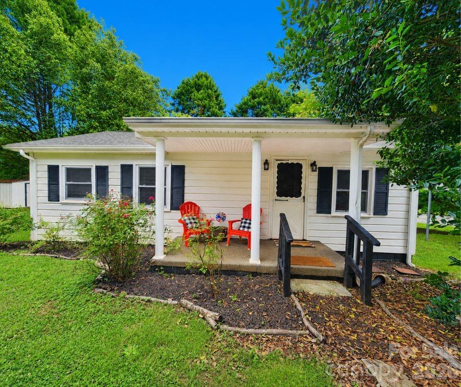 Welcome to your own private country retreat! Nestled in a peaceful rural setting, minutes to Dallas, Lincolnton, Cherryville and Gastonia.  This charming 2-bedroom, 1-bath home offers the perfect blend of comfort, privacy, and affordability. From the moment you arrive, you'll appreciate the inviting covered front porch—an ideal place to enjoy your morning coffee, unwind in the evenings, or simply take in the quiet surroundings.

Inside, you'll find a warm and welcoming floor plan featuring beautiful hardwood floors, a cozy living area, and a spacious laundry room complete with a washer and dryer that convey with the home. The kitchen has been refreshed with freshly painted cabinetry, creating a bright and inviting space for everyday living.

Step outside to enjoy the fenced backyard, perfect for pets, gardening, or entertaining family and friends. A detached carport provides covered parking, while the updated roof offers added peace of mind for years to come.

Whether you're a first-time homebuyer, looking to downsize, or searching for a peaceful country getaway, this property offers exceptional value and the relaxing lifestyle you've been looking for. Don't miss your opportunity to own this move-in-ready home where quiet country living meets everyday convenience!