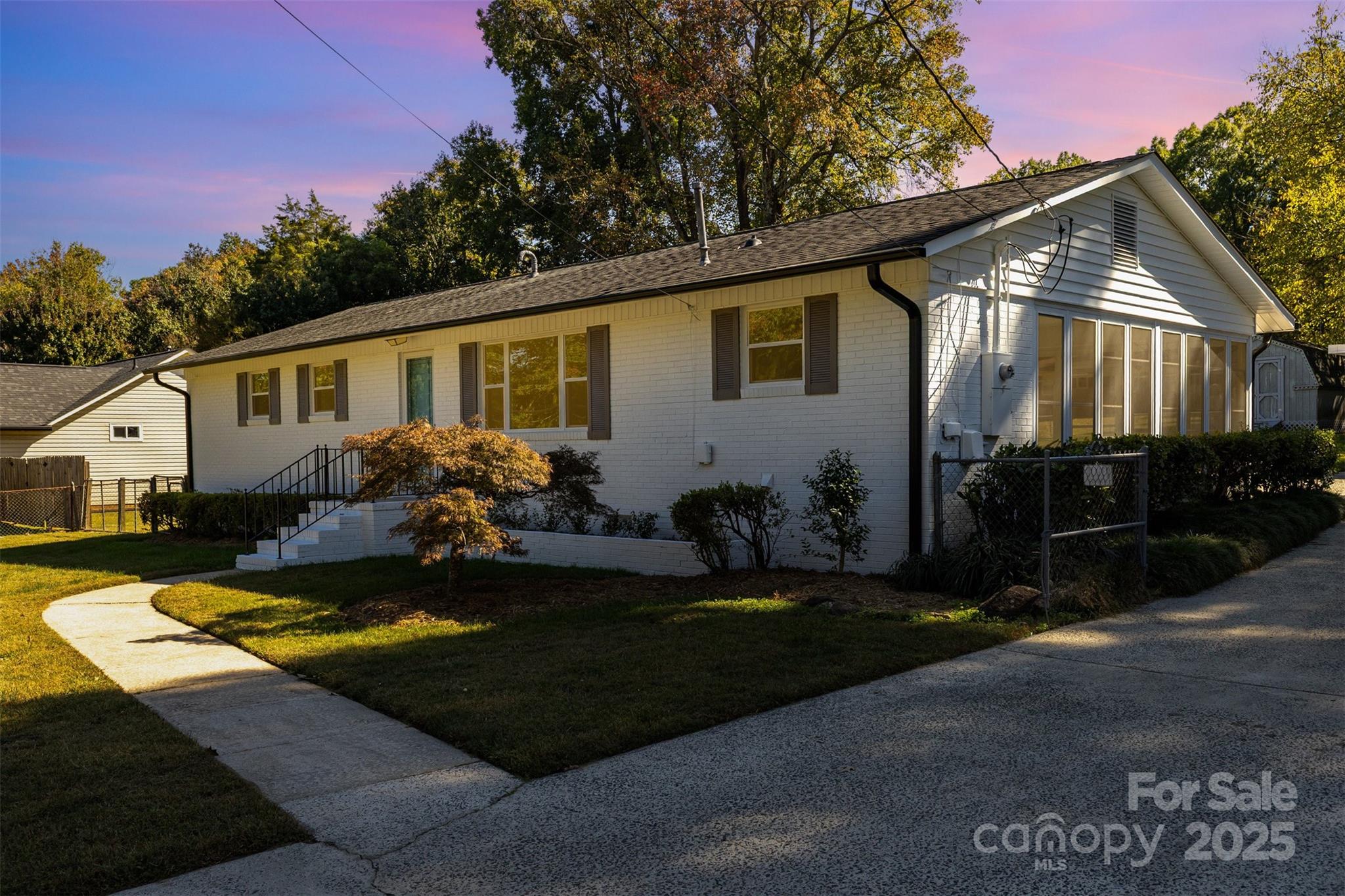 Welcome home to this beautifully remodeled 3-bedroom, 2-bath brick ranch where every detail has been thoughtfully updated in 2025! The curb appeal shines with freshly painted brick, updated gutters and windows, and a new mailbox that sets the tone for what’s inside. Step into a bright, inviting interior featuring recessed lighting, stylish LVP flooring in the main living areas, updated door hardware, and fresh paint throughout the home. The kitchen has been tastefully refreshed with painted cabinetry, sleek quartz countertops, an upgraded faucet, and a stainless-steel dishwasher—offering a clean, modern look. The primary suite includes an updated vanity, while the hall bath features refinished tile for a crisp, timeless finish. New carpet in the bedrooms adds a polished touch throughout. Outside, enjoy a spacious, level backyard that’s fully fenced—perfect for gatherings, pets, or play. Two storage sheds provide plenty of space for tools, lawn equipment, or hobbies. Behind the scenes, important upgrades like a replaced electrical panel provide lasting value. With its classic brick exterior, single-level layout, and convenient location near shopping, dining, and everyday essentials, this home showcases quality updates inside and out. All the work has been done—move right in and enjoy your beautifully renewed home!