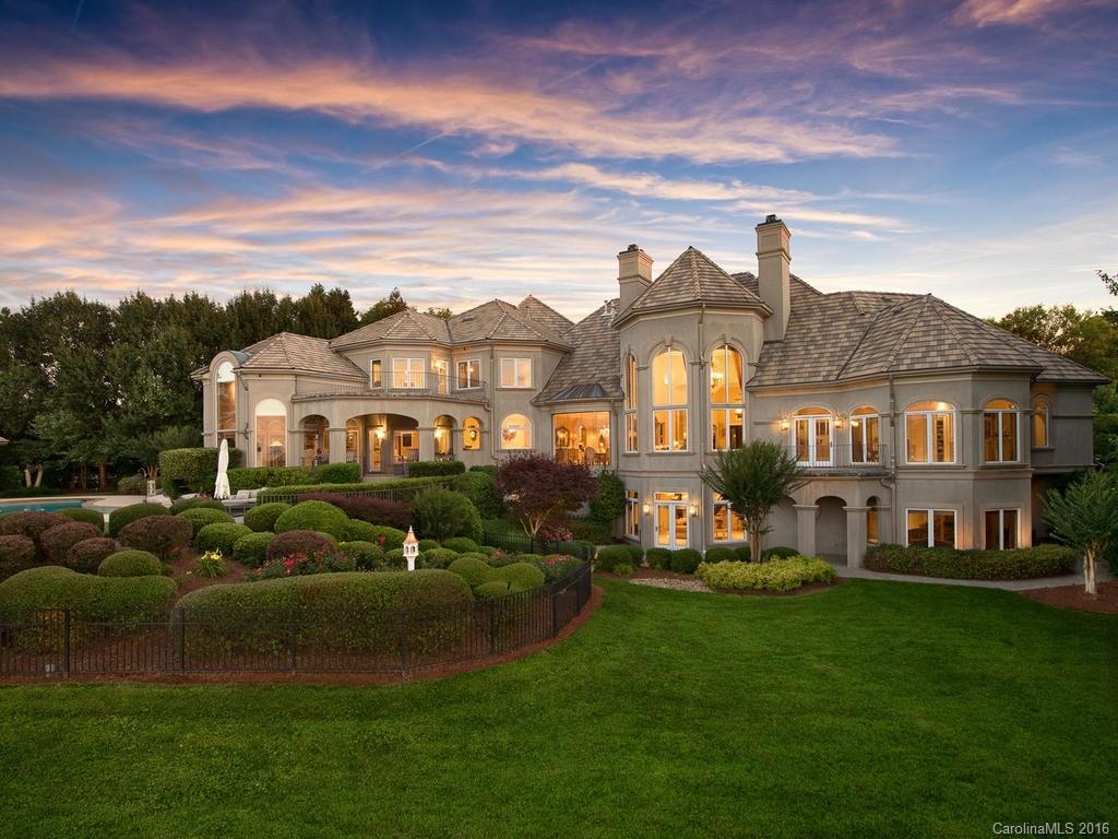 This grand estate home is perfectly located on Lake Norman with 315 ft of shoreline, this French Country gated estate provides almost 10,000 SF of lakefront living, over 5,400 SF on main level. This elegant property boasts a private dock, gazebo, custom pool, hot tub & dramatic views. Three levels of relaxed living with 5 bedrooms, 6 baths, home theater, open kitchen to breakfast and den all facing views of the lake and pool. This Peninsula home is finely finished and designed on a grand scale.