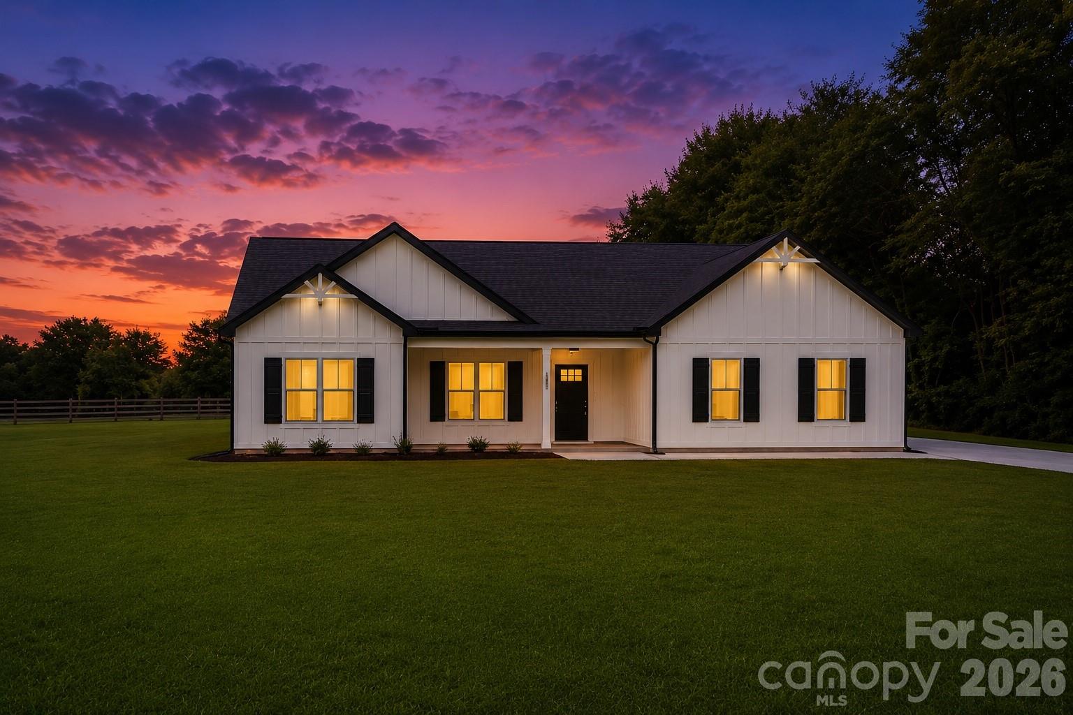 Builder is offering a $7500 credit for rate buyer down and/or closing costs! Modern farmhouse design meets relaxed living in this beautifully crafted new construction home situated on a level .77-acre lot. Offering over 2,400 square feet of single level living space, this 4-bedroom, 2.5-bath residence combines style and function with a thoughtful layout and no carpet throughout for a clean, modern finish. Hardie board siding accented with black trim creates striking curb appeal with a timeless farmhouse influence. Inside, the open floor plan is designed for both everyday living and entertaining. The kitchen stands out with an expansive island, abundant cabinetry, soft-close drawers, and stainless steel appliances, seamlessly connecting to the dining and living areas for a spacious, open feel. The split-bedroom design enhances privacy, with an oversized primary suite featuring an oversized bath complete with dual vanities, tiled flooring, tiled shower, and a large walk-in closet. Enjoy year-round outdoor living on the covered rear sitting area, perfect for relaxing or hosting guests, along with a welcoming front porch that overlooks the expansive yard. The oversized side-entry garage, professionally finished with epoxy flooring, provides excellent space for storage, a workshop, or hobbies. Ideally located with quick access to Highway 321, this end home offers extra privacy, storage galore, and a comfortable balance of convenience and space for everyone.