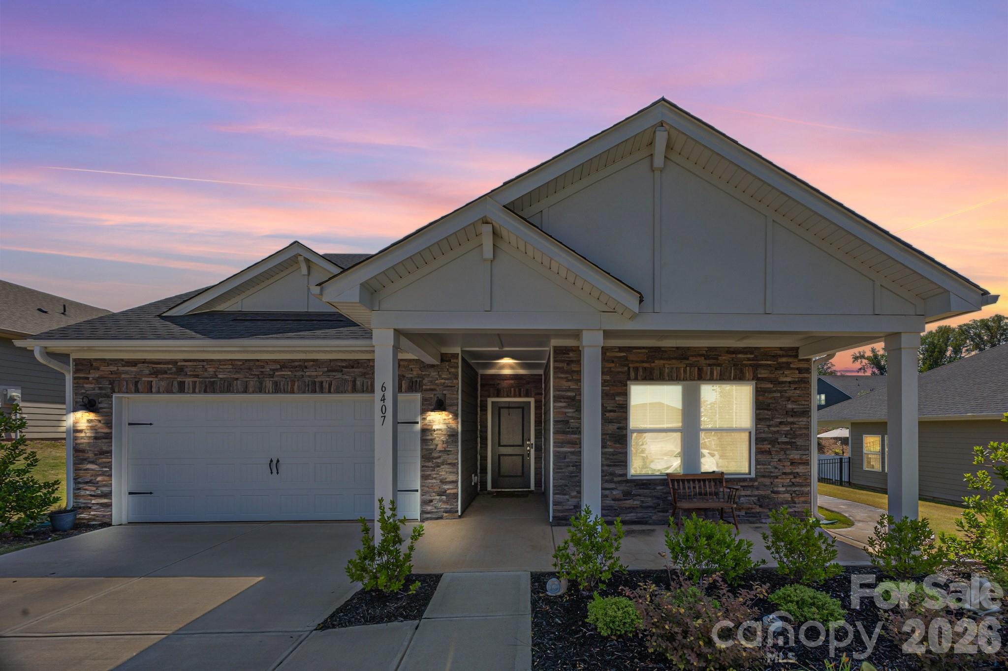 Better than new! Resort style living on Lake Wylie— built late 2023, this 4BR/3BA home with bonus room checks every premium box. Premium engineered hardwood floors flow through open main living areas anchored by a chef's kitchen featuring a double wall oven, stainless steel appliances, quartz countertops, upgraded cabinetry, and an improved pantry. The primary suite boasts a frameless tile shower with rain head and bench, dual vanity with upgraded lighting, and a tasteful accent wall behind the upgraded vanity mirrors. Every walk-in closet is fully upgraded for maximum organization.
From an efficiency standpoint, this home is in a class of its own. Built by one of the few builders in the area to use full spray foam insulation, the result is an exceptionally airtight, energy-efficient home — and noticeably lower utility bills month after month. The spacious 2-car garage completes the interior package.
Outside, a professionally landscaped yard is enclosed by sleek black aluminum fencing. A dedicated side pathway leads to an extended back patio with a louvered pergola featuring an adjustable roof — ideal for year-round entertaining. A row of fast-growing privacy trees lines the back, already working toward a lush natural privacy wall.
The amenities rival a private resort: two large pools, clubhouse, grilling stations, fitness center, Lake Wylie access with boat dock and ramp, storage for all your water toys, approximately 10 miles of walking trails, a playground, a dog park, and a sports complex with pickleball and bocce ball courts with covered seating.
Located minutes from the emerging River District, charming downtown historic Belmont, CLT Airport (11 min), and Uptown Charlotte (25 min). Resort living, historic charm, and city access — all in one.