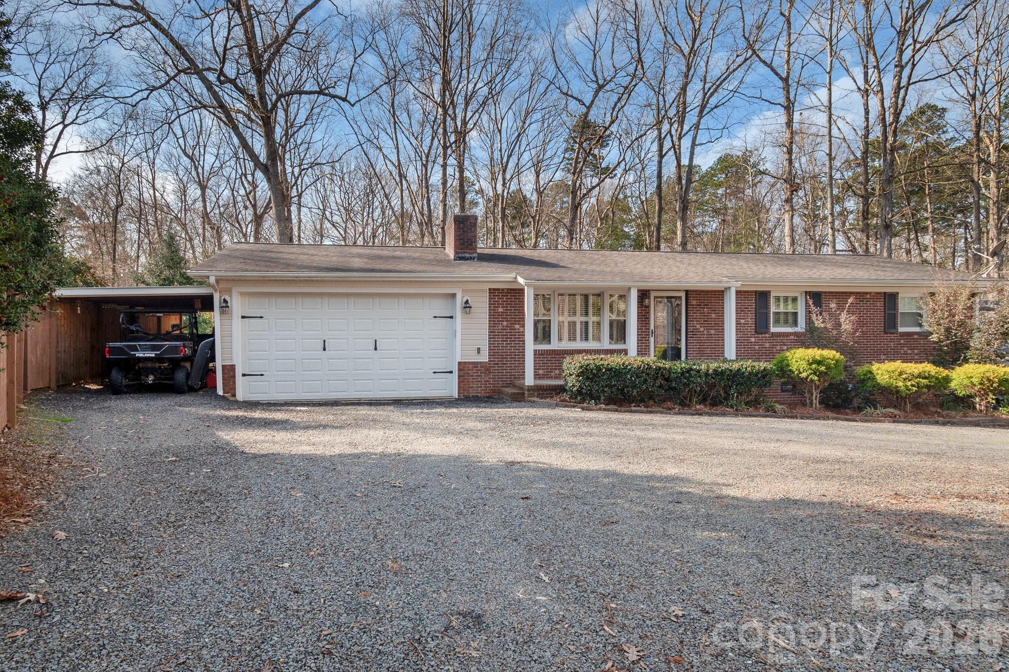 Welcome home to 127 Possum Rd! Located within the beautiful gated community of Woodrun, this home offers the best of both worlds-peaceful surroundings with easy access to all the fun of lake life!

Step inside to a bright, open layout designed for both everyday living and effortless entertaining. The living area flows seamlessly into the dining space and kitchen, creating a welcoming atmosphere that feels both comfortable and connected. The home features two bedrooms and two full bathrooms, perfect for those just starting out or downsizing. The versatile family-style bonus room is perfect for a second living area, media room or office.
If you enjoy being outdoors, this home is for you! With a tranquil backyard, perfect for unwinding after a long day and a back deck designed for spending time with family and friends- this outdoor space will be your new oasis!

Residents can enjoy an incredible lineup of amenities including a community pool with lake views, scenic walking trails, tennis courts and more! Whether you're taking an evening stroll, spending sunny afternoons by the pool, or heading out for a day on the lake, Woodrun on Tillery is for enjoying every minute of it. 

Don't miss out on your opportunity to own a home in this sought out lake access community! Schedule your private showing today and see everything this home and community have to offer!