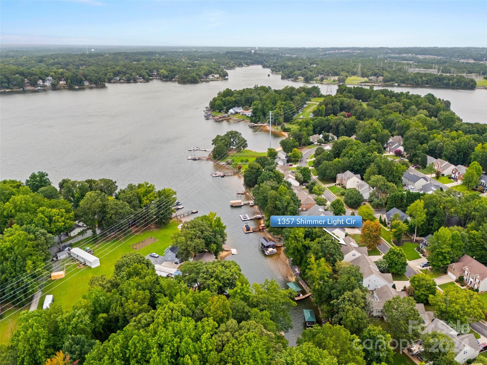 This waterfront home on Lake Wylie is the perfect retreat for those seeking peace and tranquility. Enjoy beautiful sunsets from the large expansive deck featuring a sunken hot tub and outdoor kitchen. The house has an open floorplan with vaulted ceilings and a wall of windows. The kitchen features granite countertops, a 5-burner gas stove with a double oven and an extended area with a wine fridge. The primary bedroom is on the main level with a door to the deck. Upstairs, there are two additional bedrooms, a newly remodeled bathroom with a walk-in shower and a large bonus room. There is a deeded boat slip in a gated area, just off the pier in the common area about a block away. 

Neighborhood amenities include a pool overlooking the lake, boat storage, a beach, and a picnic area.