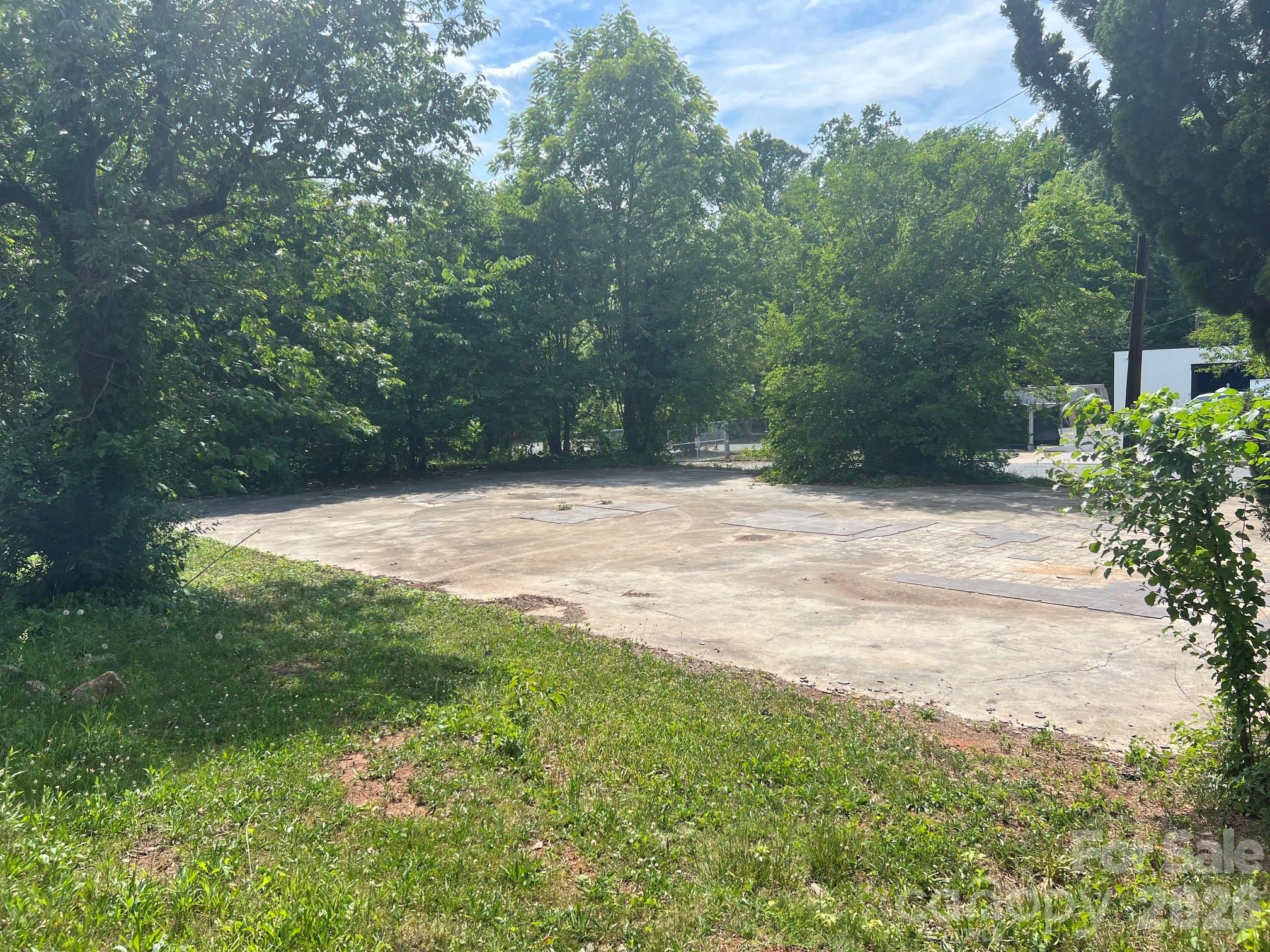 Exceptional cleared corner lot opportunity that offers easy access along on the busy corridor of US-74. Zoned OFC-- property presents flexible development potential. Possibility for triplex/quadruplex development-- check with city for verification.