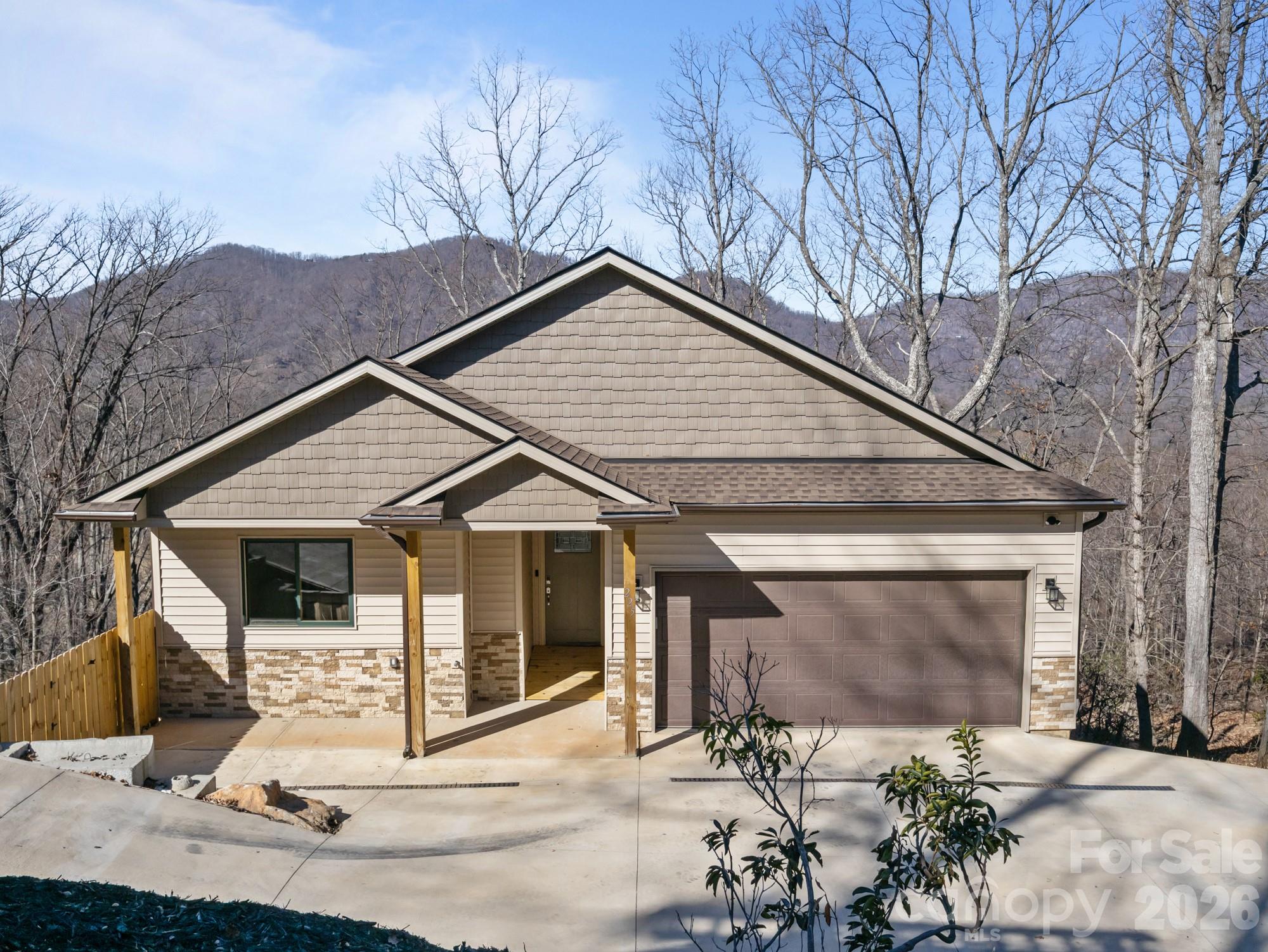 New construction (2025) 3BR/2BA home on 1.19 acres in Thermal View Heights, Tryon. Thoughtfully designed with a central media hub and CAT-5 home runs to the family room and all bedrooms. Seasonal mountain views.
Upper deck accessed from the living room and primary bedroom; lower deck accessed from the unfinished basement. The unfinished basement offers flexible potential for an office, workshop, rec room, storage, or an additional bedroom. Two-car garage plus driveway parking for 1–2 additional vehicles depending on size.
Convenient to Harmon Field and downtown Tryon, and roughly 20 minutes to the equestrian center. Property backs to the upcoming Rail Trail. Private road with maintenance agreement. Fire hydrant within 200' of home. Propane serves range, water heater, and fireplace (leased tank). Dryer hookup for electric or propane. Utility sink in garage.
Great functionality for a family home or potential short-term rental/Airbnb.