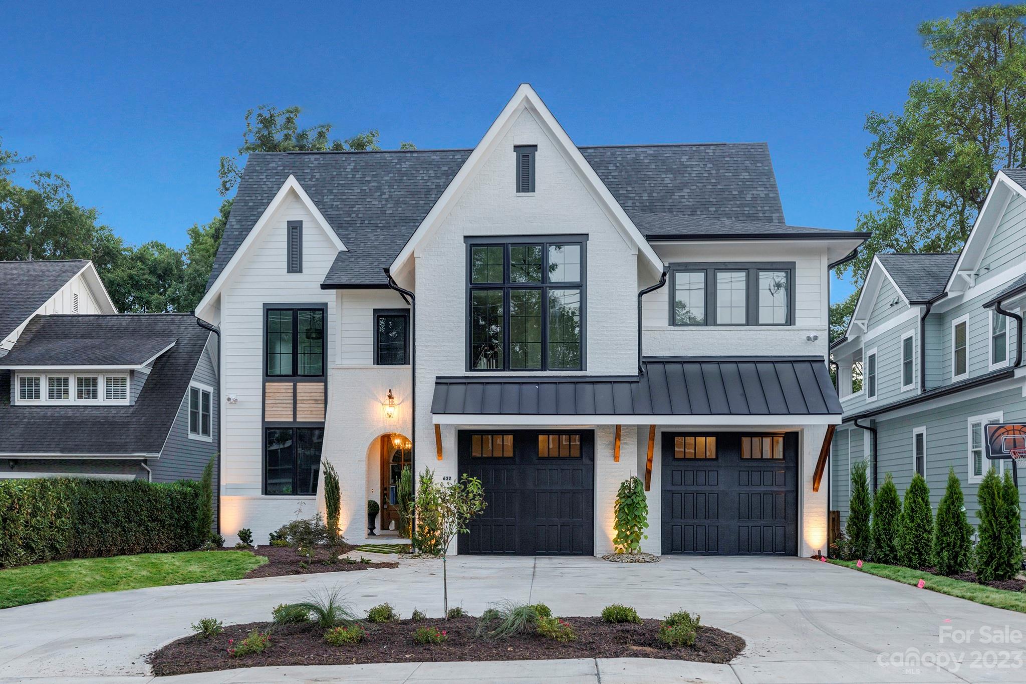 Luxury Transitional 5,807 sq ft 6 bed/6 bath Dilworth new build by A3 Custom Homes. Open floor plan w/ designer finishes throughout. The kitchen has an oversized island, JennAir range, 6' refrigeration, quartz countertops and large scullery w/ an ice maker and beverage refrigerator. The family room has ceiling beams, a cast stone fireplace surround. The outdoor living includes a built in kitchen (grill, sink, refrigerator, and exhaust hood), a fireplace and large fenced private yard w/ access to a greenway/Sedgefield park. White oak hardwoods throughout and all bedrooms have ensuite bathrooms. The Primary bedroom has a private den/office/flex that is accessed by a hidden door, walk-in shower/free standing tub next to an electric fireplace and a walk in closet with an island. The home also has a large bonus room that is connected to a bar area and a guest suite. Central location that is an easy walk to shops/restaurants. Exterior has irrigation/sod & a circular driveway.