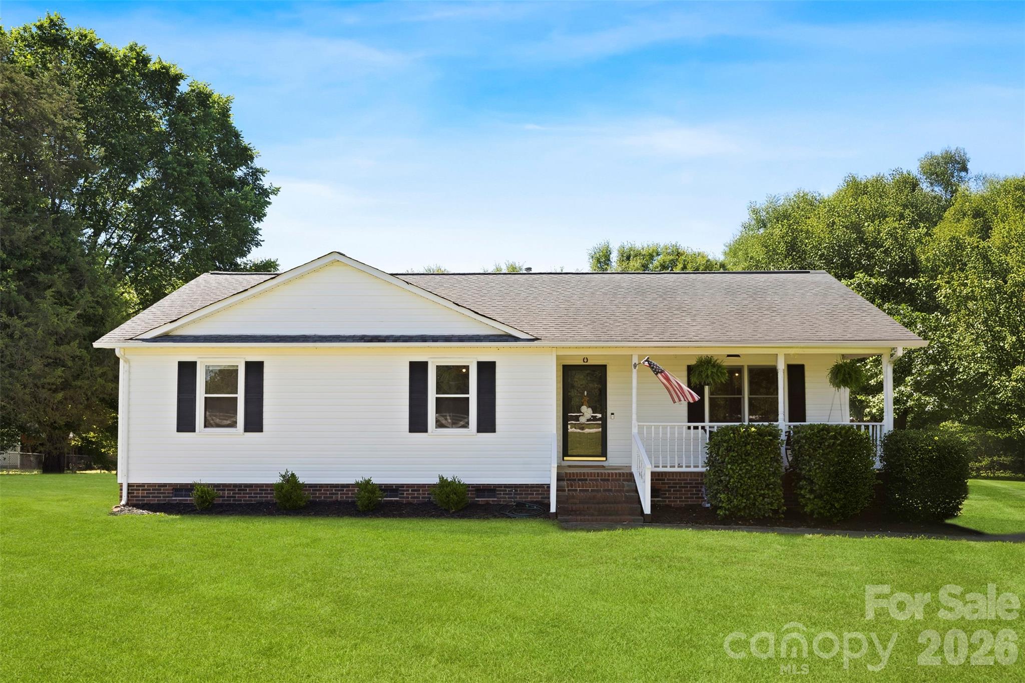 If you've been dreaming of a little more space, a little more privacy, and a place where life can slow down, this Clover property may be exactly what you've been looking for.

This one-story farmhouse-style ranch features 3 bedrooms, 2 baths, a large eat-in kitchen, and a cozy fireplace, all designed for comfortable everyday living.

Set on 3.58 acres, you'll have room to enjoy your morning coffee on the front porch, spend evenings around the barn and pasture, or simply take in the peaceful views of your own land. A creek, mature trees, fenced pasture, and multiple outbuildings create endless possibilities for horses, hobbies, gardening, or enjoying the outdoors.

With no HOA and plenty of room to make it your own, this property offers more than a home—it offers a lifestyle that's becoming increasingly hard to find.