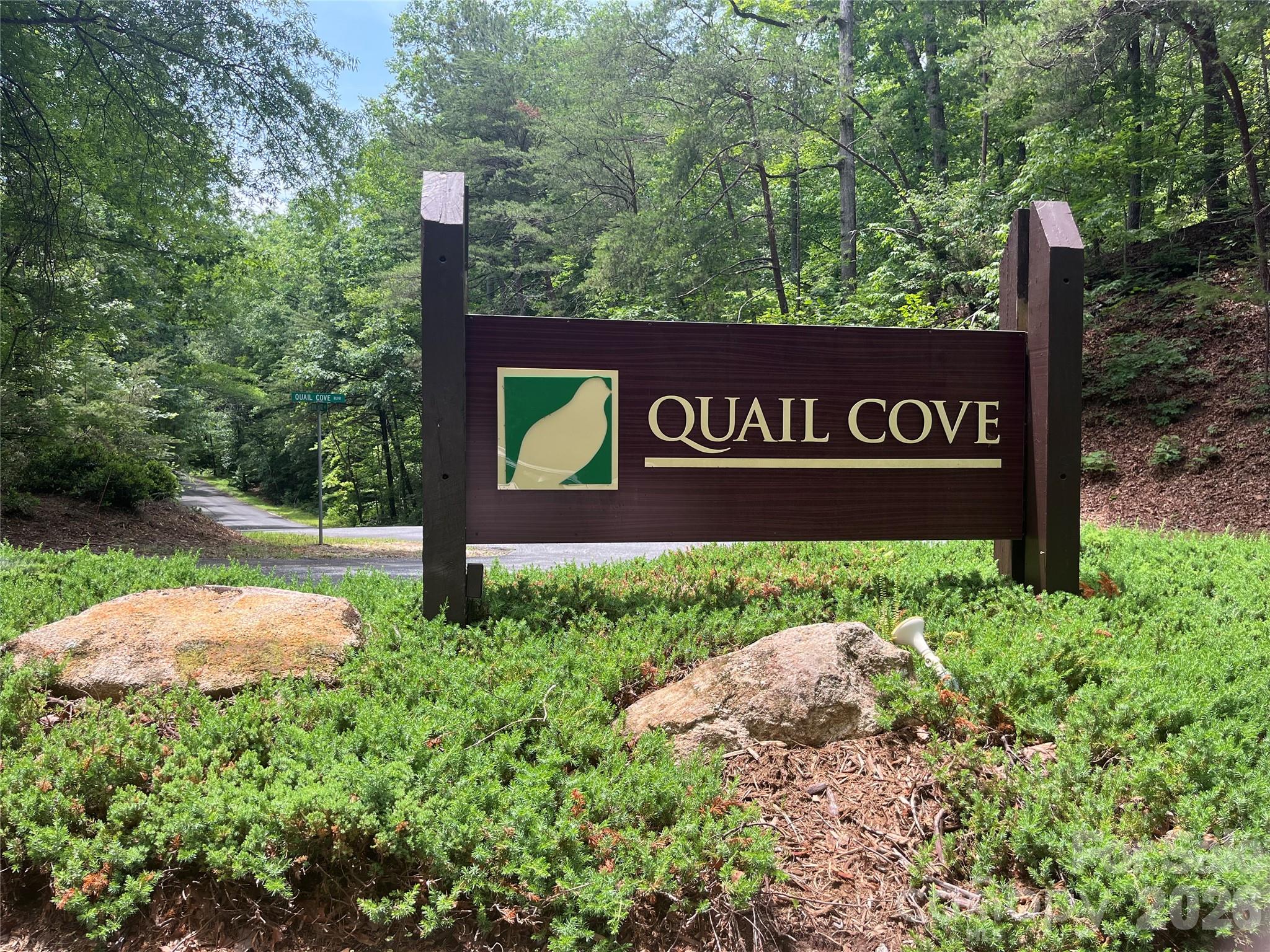 GREAT RENTAL HISTORY on this recently renovated townhome with a bright, modern and open floor plan. Gross rental income was $44,828 in 2023, $42,825 in 2024(Helene shortened season) and $34,827 in 2025 while the lake was closed. Expectations are to exceed pre-Helene numbers in 2026 with the lake NOW OPEN! Seasonal peek-a-boo lake views from two private balconies of this luxury 2 BR, 2 BA with a heated and air-conditioned finished lower level, a rarity for this association, which is currently being used as a rec room, but could easily be turned into an extra bedroom or bathroom, or both. Renovations & updates in 2023 include new hardwood flooring throughout, new kitchen cabinets, granite countertops, new furniture in every room, new bathrooms, all new fixtures and decor. Prime location just a 2 min drive to amenities & restaurants of Rumbling Bald, offering something for all generations to enjoy. Private beach, marina, boat tours, 2 championship mtn golf courses, full-service spa and salon, indoor and outdoor pools, restaurants & bars, tennis/pickleball/basketball courts, miniature golf, boat rentals, etc. Enjoy your mountain retreat without all the maintenance of homeownership. The Quail Cove Townhouses are located behind the gates of the Rumbling Bald on Lake Lure community.